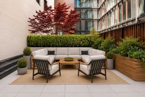 a backyard of a house with outdoor seating