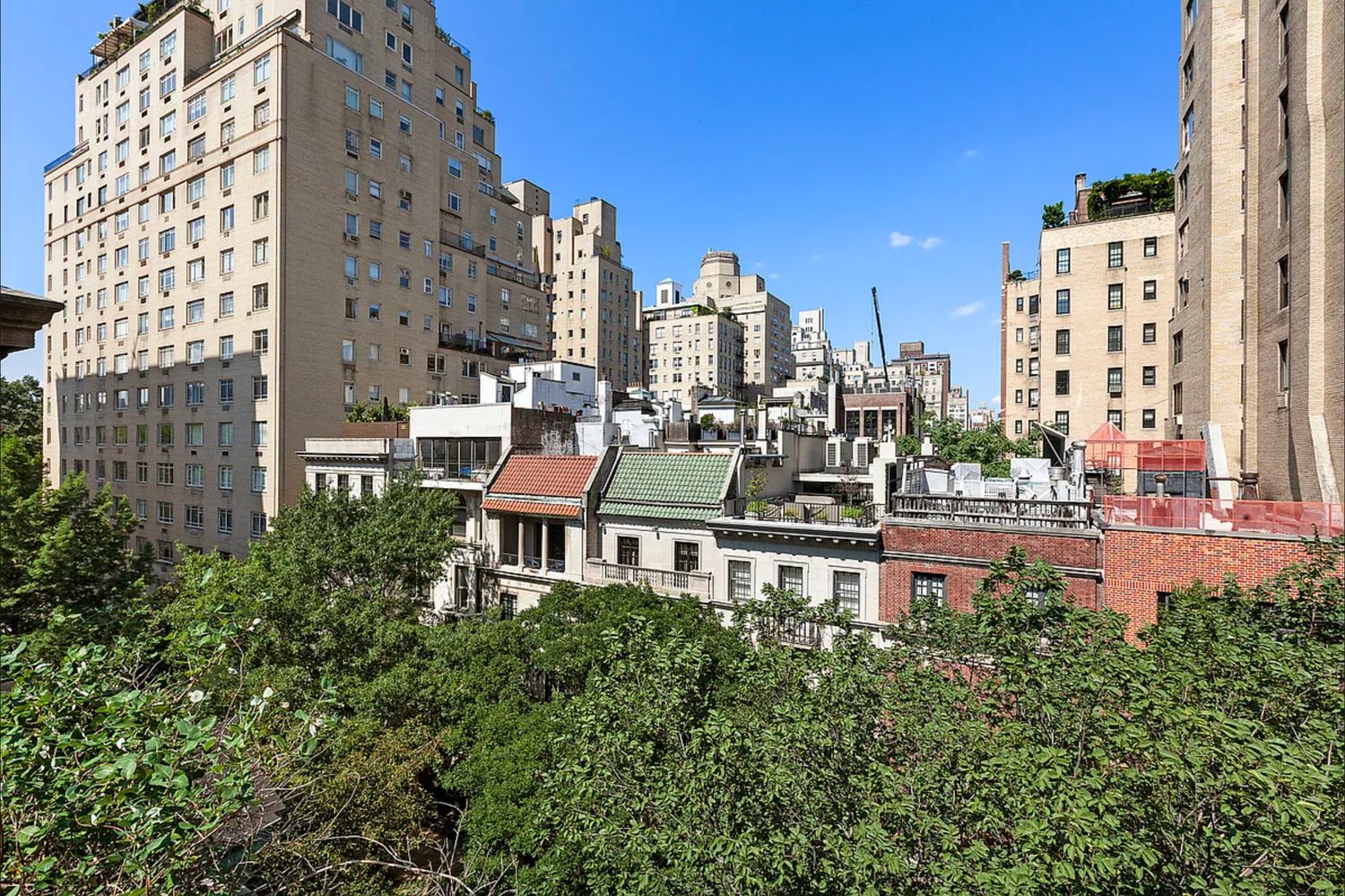 16 East 74th Street, Unit 4/5 Manhattan, NY 10021 - Photo 12 of 13 a view of a city with tall buildings and a big yard