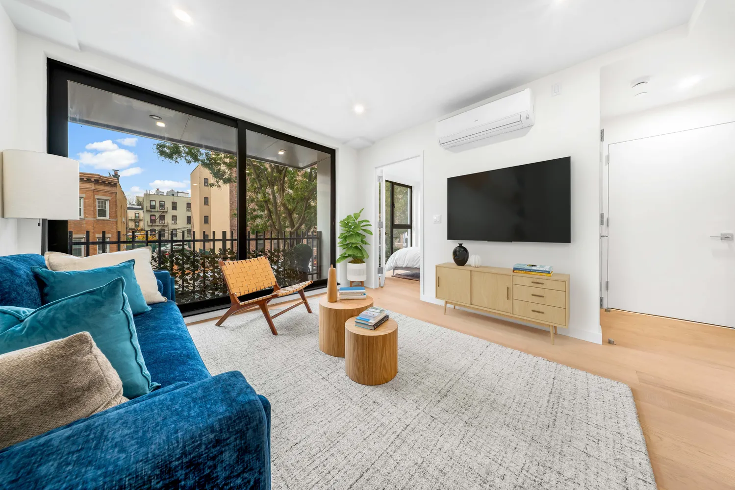 a living room with furniture and a flat screen tv