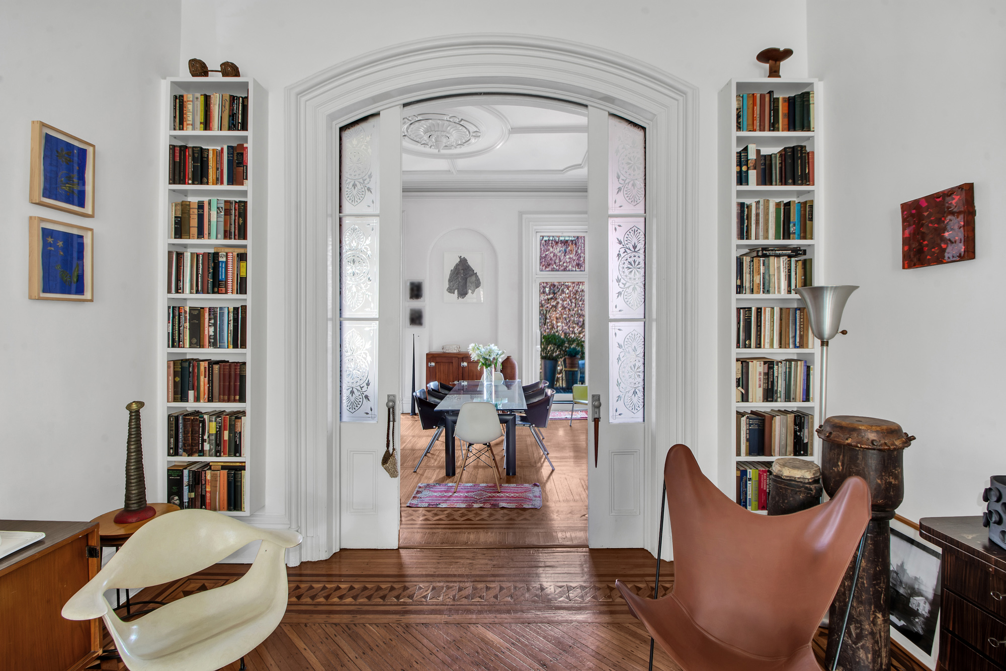 383 Grand Avenue Brooklyn, NY 11238 - Photo 7 of 32 a living room with furniture and a book shelf