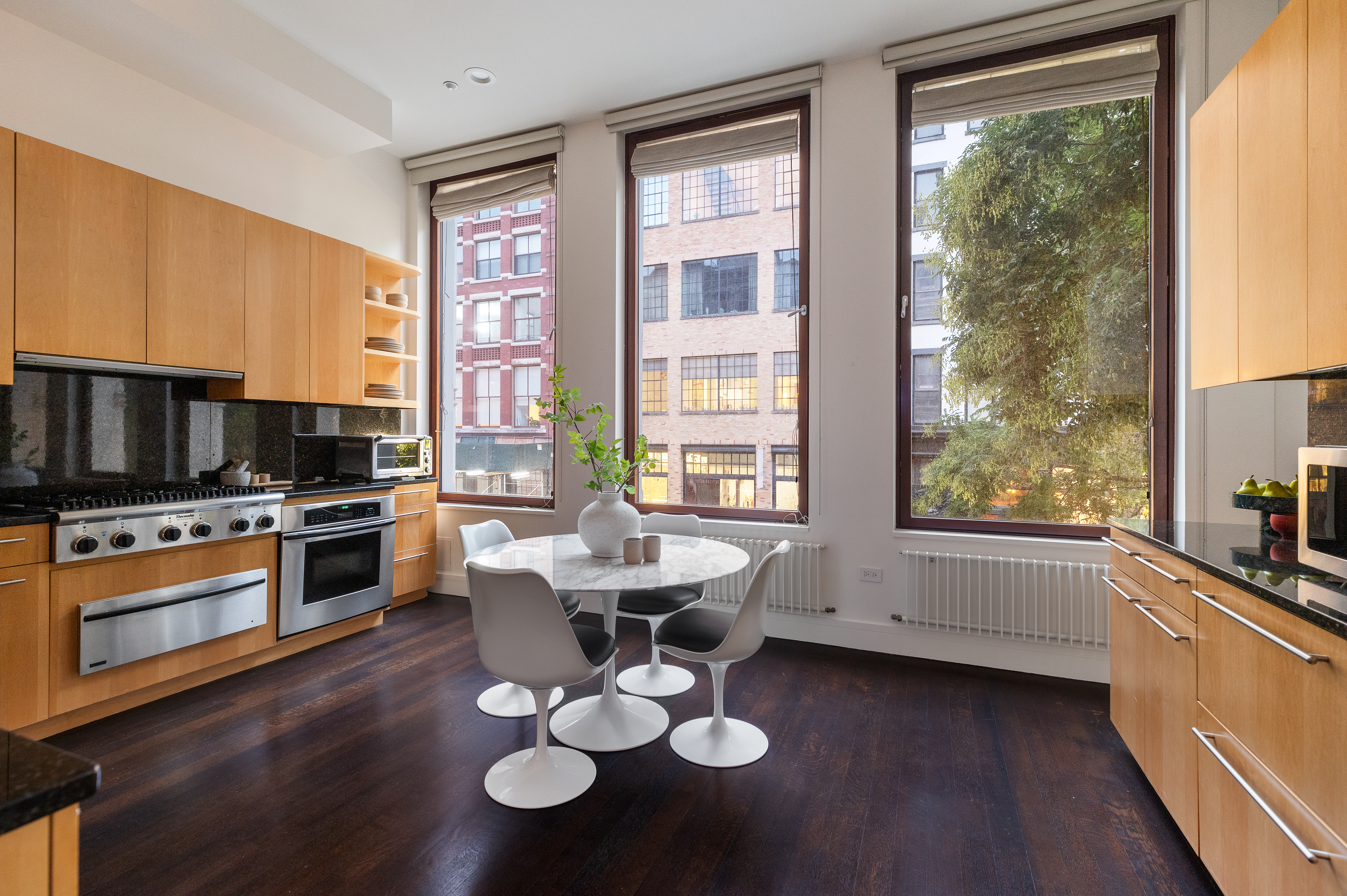 388 West Broadway, Unit 2 Manhattan, NY 10012 - Photo 9 of 27 a kitchen with sink cabinets and appliances
