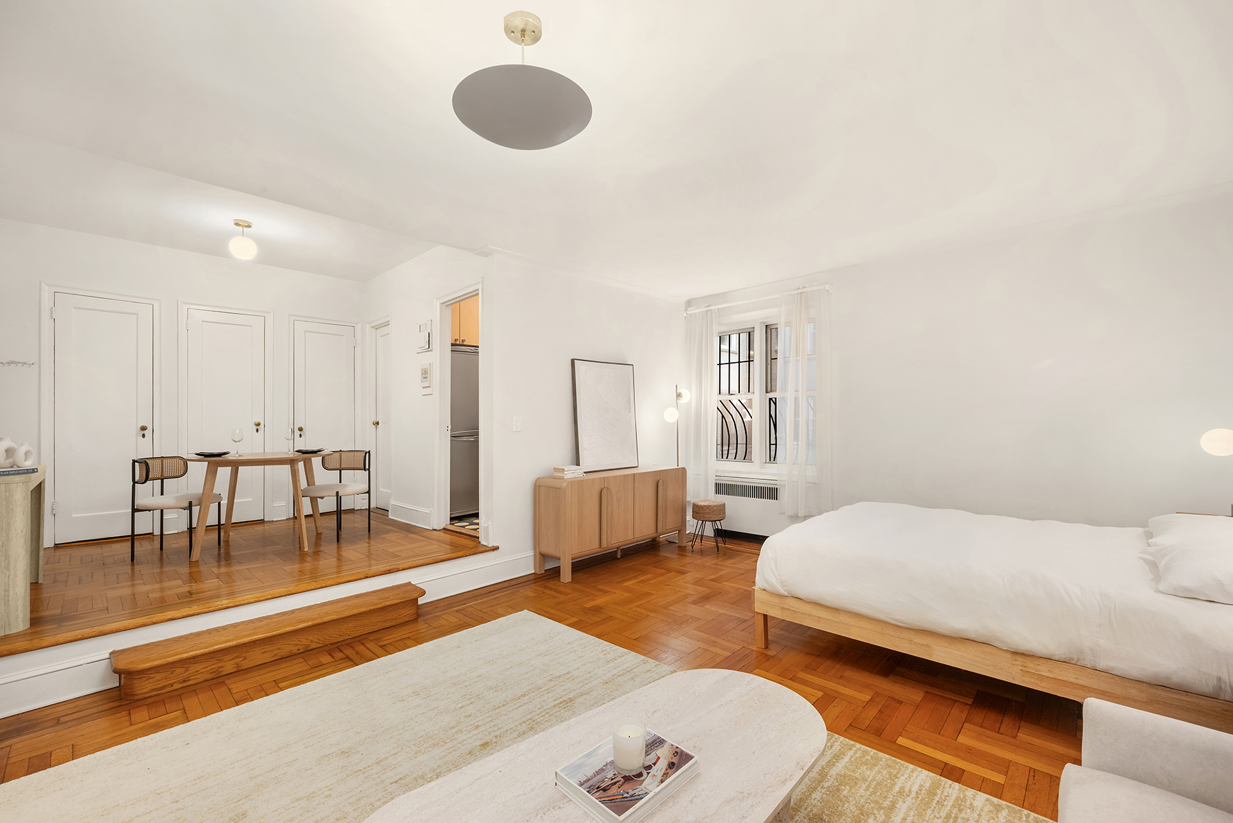 55 Eastern Parkway, Unit 1D Brooklyn, NY 11238 - Photo 2 of 8 a bedroom with a bed and a couch