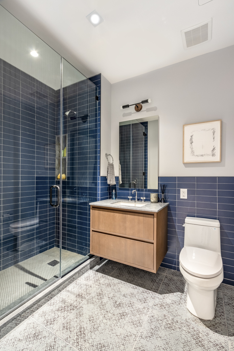 106 Franklin Street, Unit PH Manhattan, NY 10013 - Photo 8 of 13 a bathroom with a sink toilet and shower