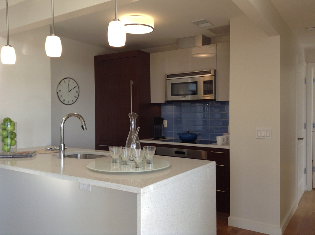 548 4th Avenue, Unit 8A Brooklyn, NY 11215 - Photo 8 of 21 a kitchen with a sink and a microwave