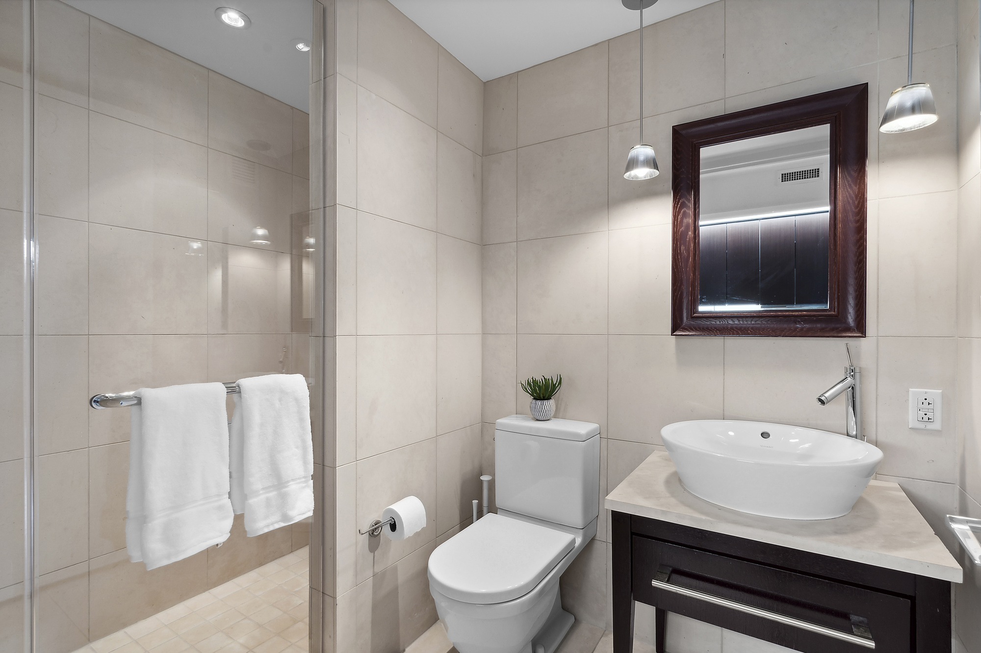 340 East 23rd Street, Unit 15G Manhattan, NY 10010 - Photo 5 of 9 a bathroom with a sink toilet and shower