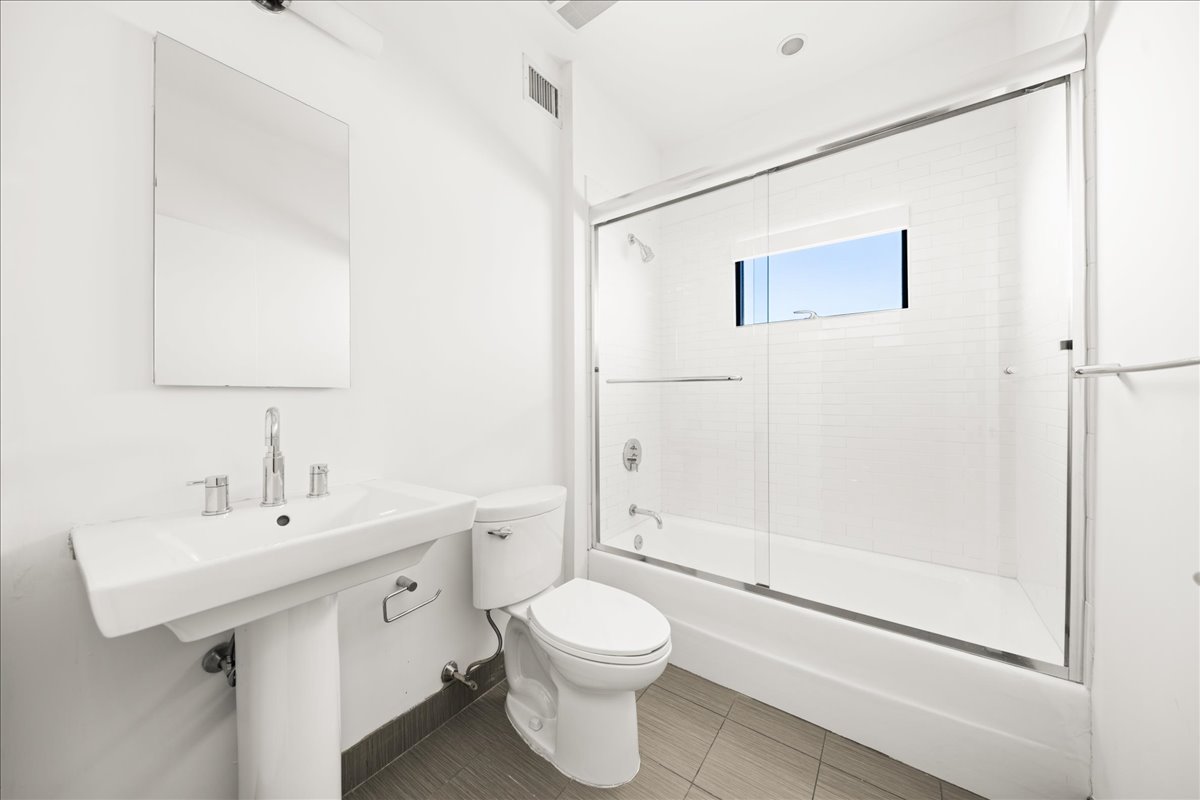 162 Beard Street Brooklyn, NY 11231 - Photo 10 of 20 a bathroom with a sink a toilet and shower