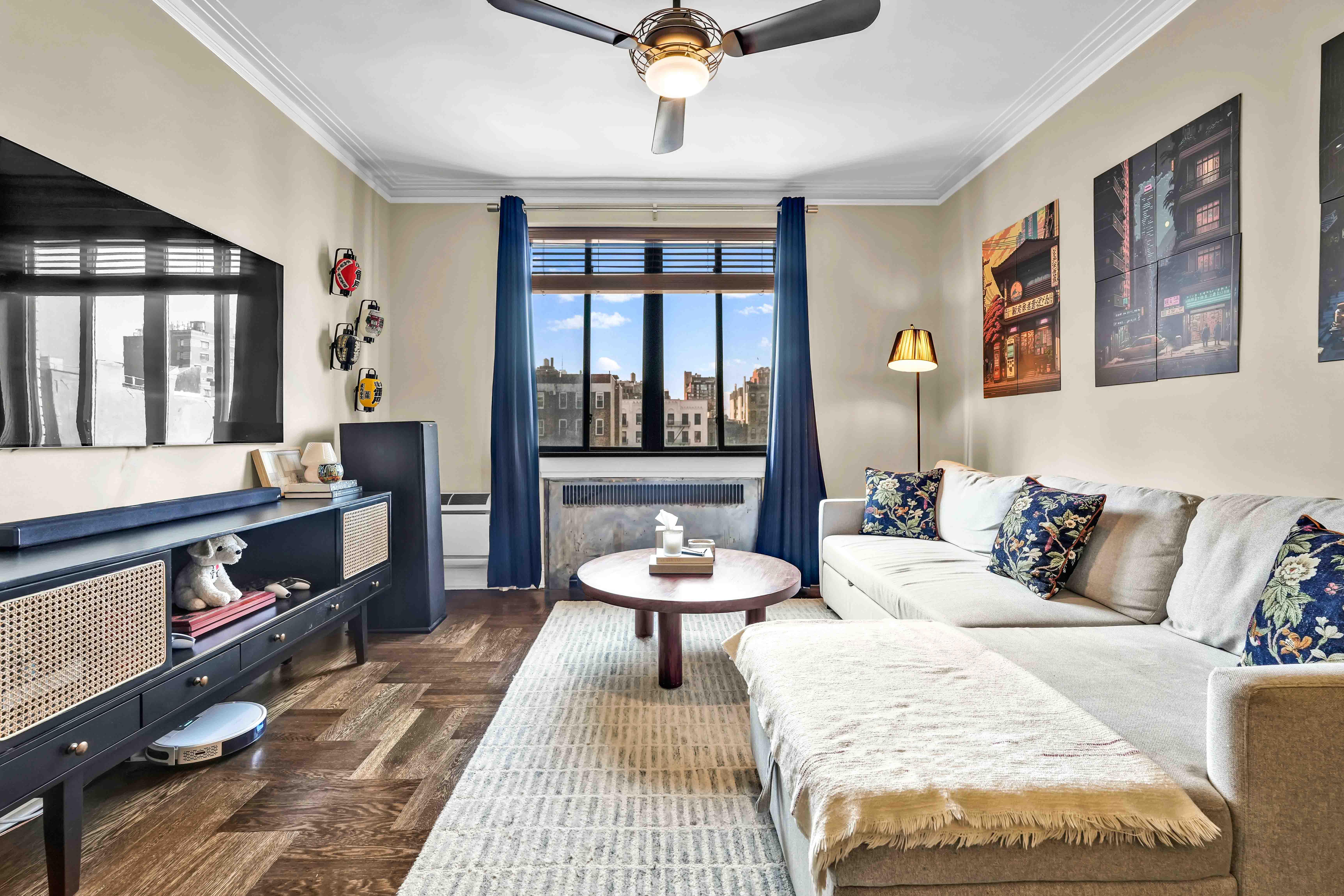 255 West 23rd Street, Unit 5GW Manhattan, NY 10011 - Photo 3 of 35 a living room with furniture and a window
