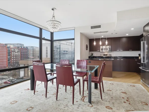 a view of a dining room with furniture window and wooden floor