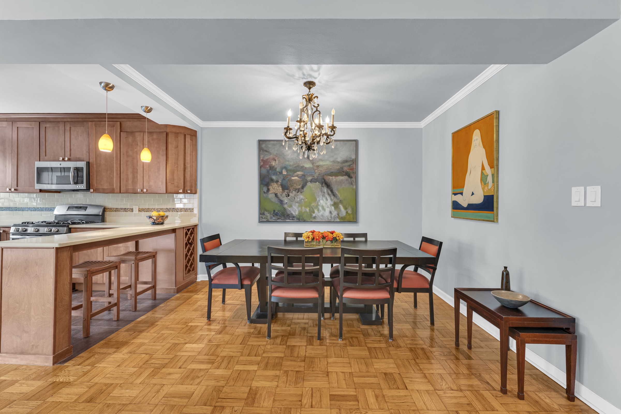 750 Kappock Street, Unit 307 Bronx, NY 10463 - Photo 7 of 20 a open kitchen with stainless steel appliances granite countertop a stove dining table chairs and a window