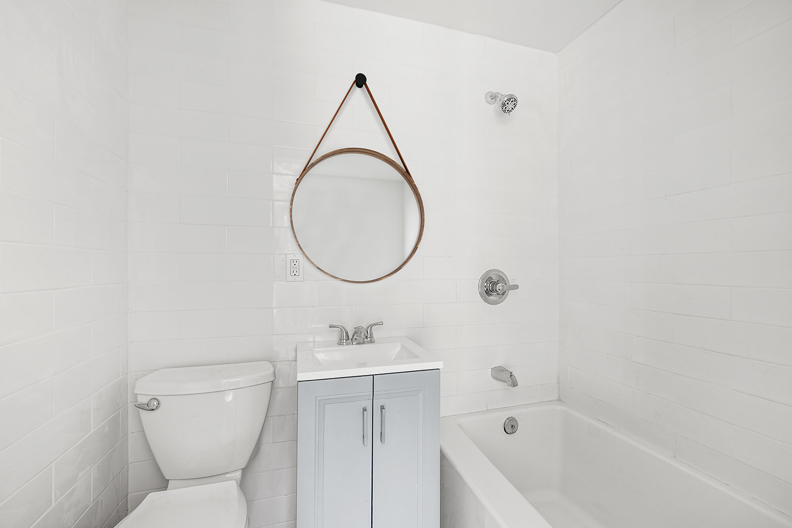 304 Lafayette Avenue, Unit GARDEN Brooklyn, NY 11238 - Photo 8 of 10 a bathroom with a sink a toilet and a mirror