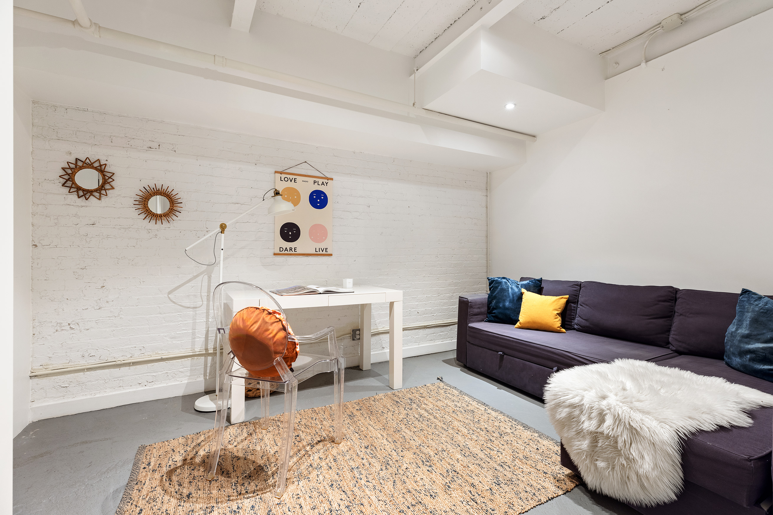 95 Lexington Avenue, Unit D1 Brooklyn, NY 11238 - Photo 11 of 13 a living room with furniture and a couch