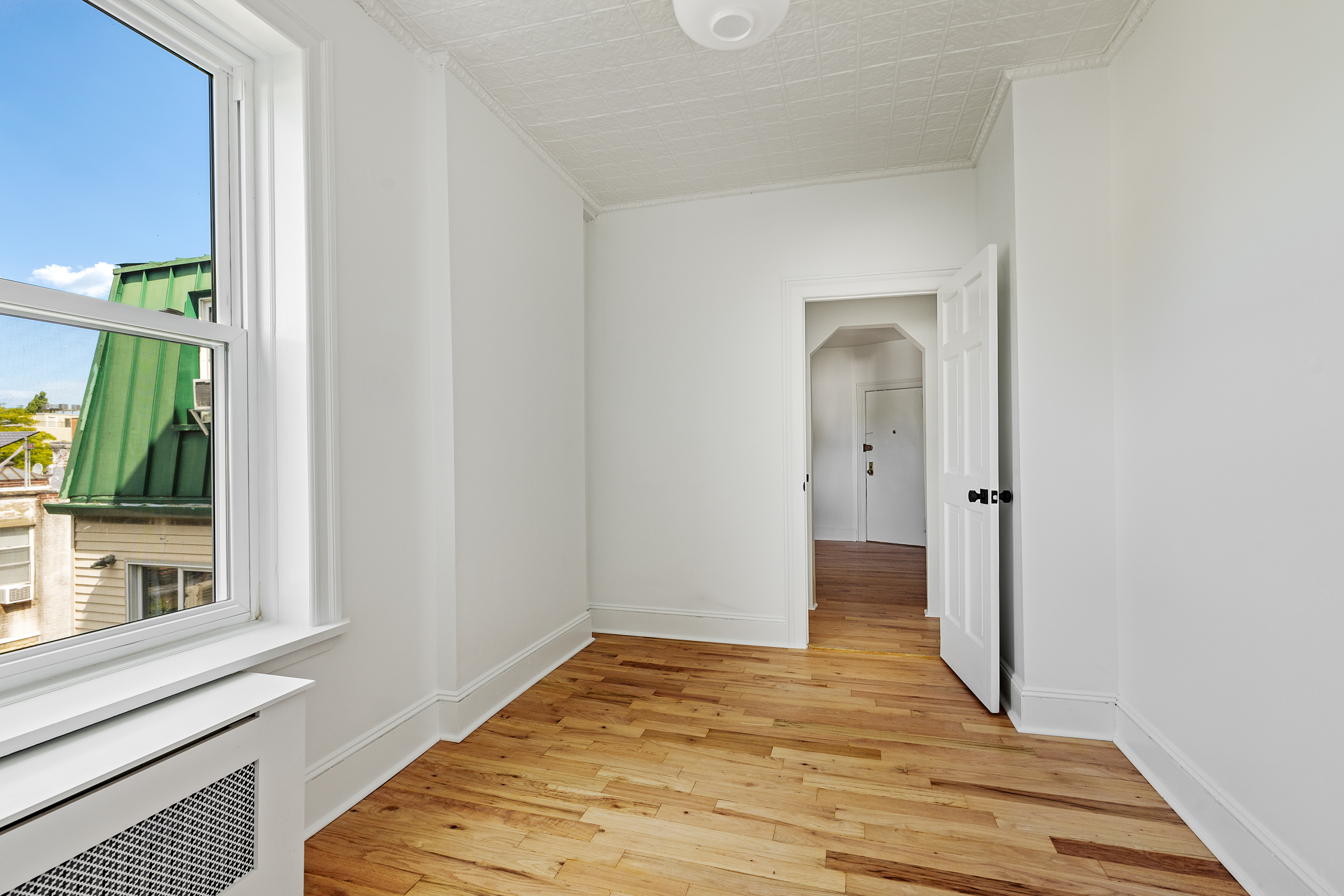 456 Prospect Avenue, Unit 3R Brooklyn, NY 11215 - Photo 14 of 16 a view of a room with wooden floor and a window