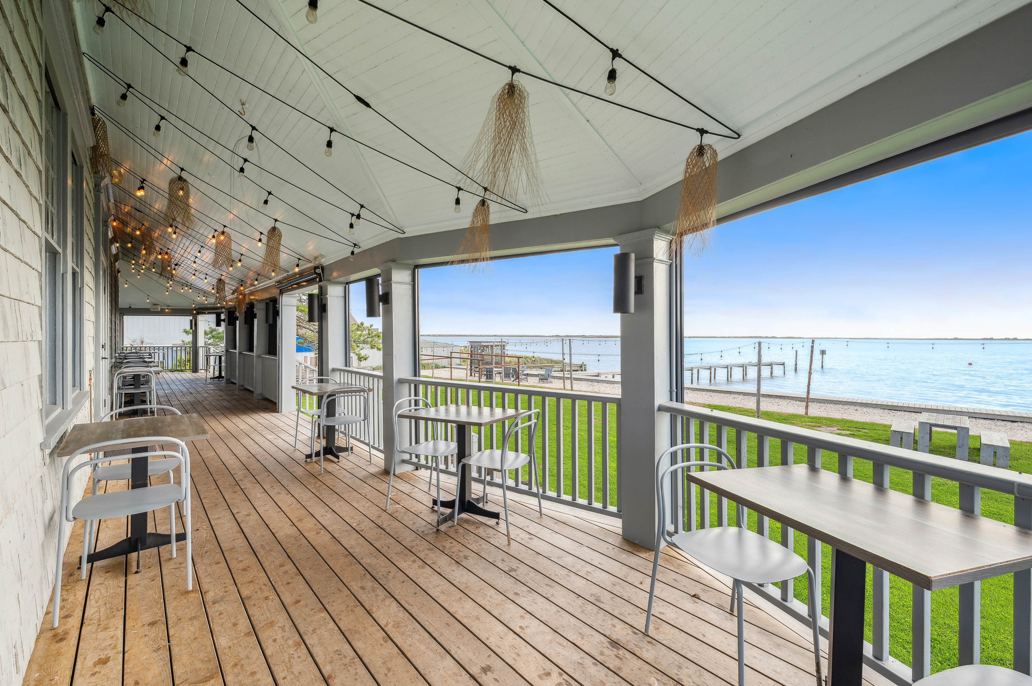 32 Lighthouse Road Hampton Bays, NY 11946 - Photo 28 of 51 a view of a balcony with wooden floor