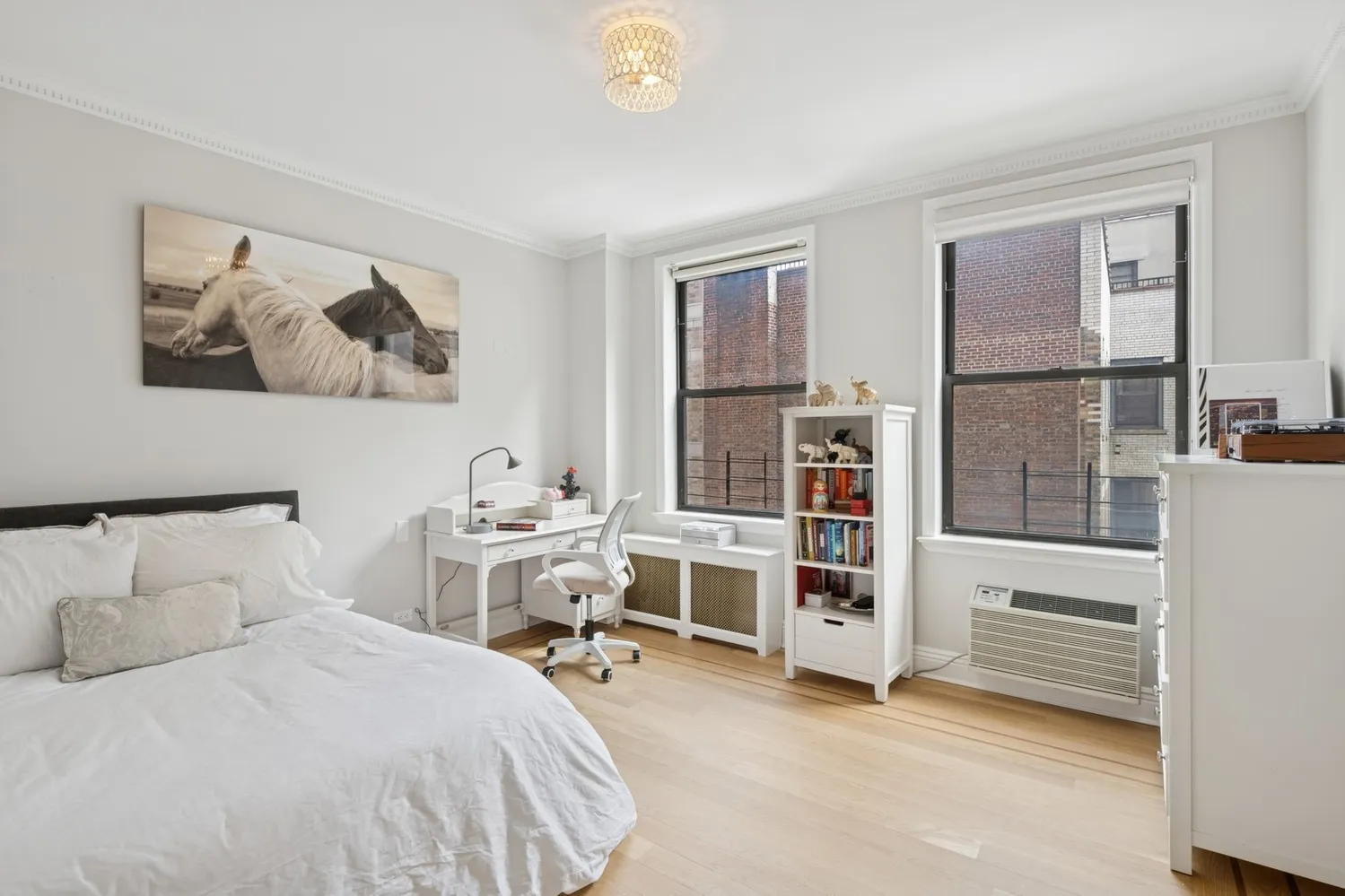 a bedroom with a bed and a cabinets