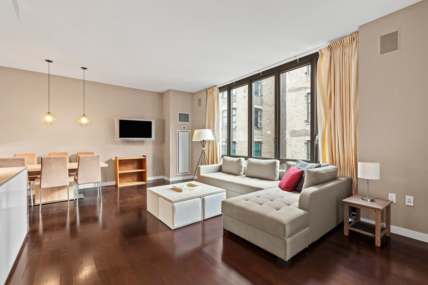 a living room with furniture and flat screen tv