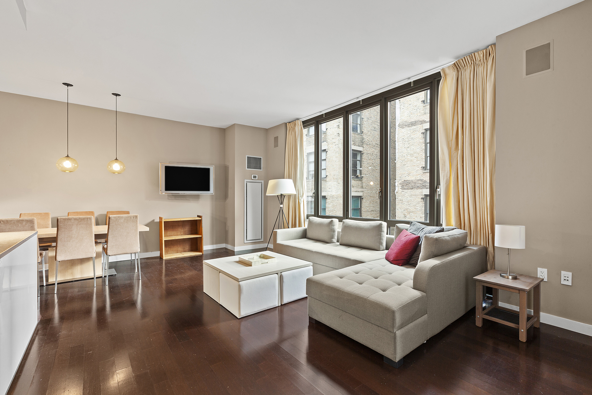 4 West 21st Street, Unit 11A Manhattan, NY 10010 - Photo 1 of 9 a living room with furniture and flat screen tv