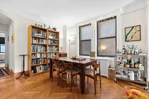 a view of a workspace with furniture and toys in a room