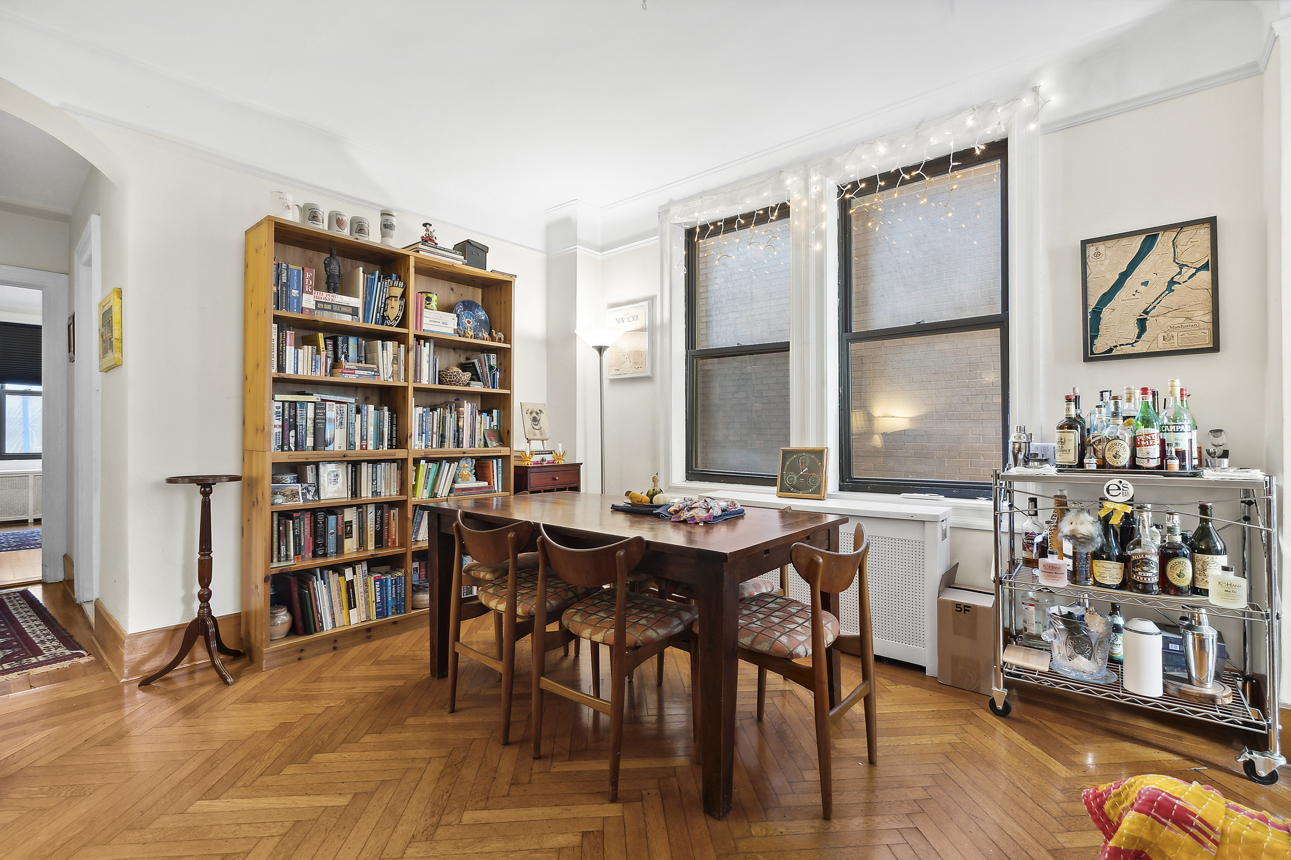 395 Riverside Drive, Unit 5F Manhattan, NY 10025 - Photo 2 of 8 a view of a workspace with furniture and toys in a room
