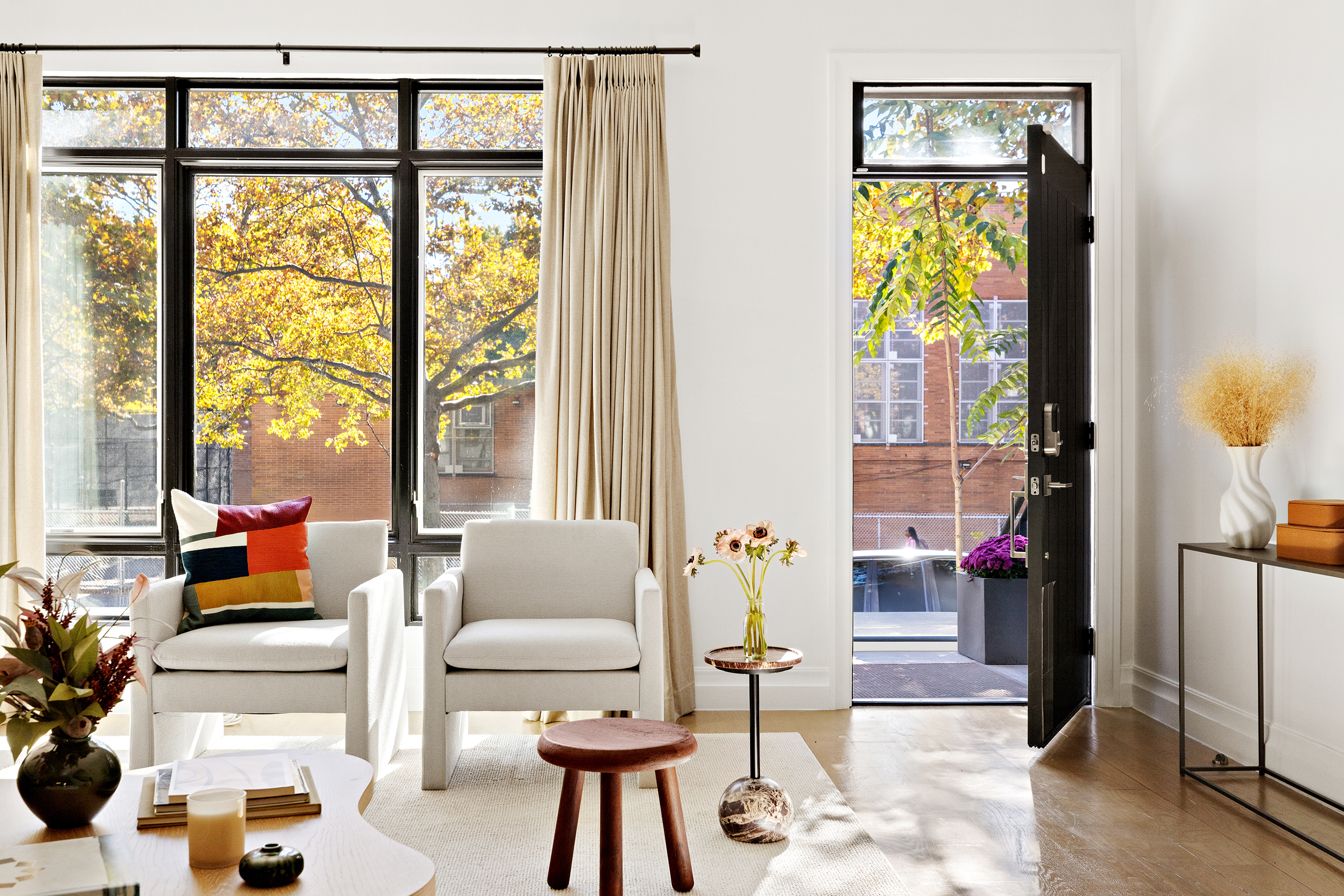 203 Halsey Street Brooklyn, NY 11216 - Photo 20 of 21 a living room with furniture and floor to ceiling windows