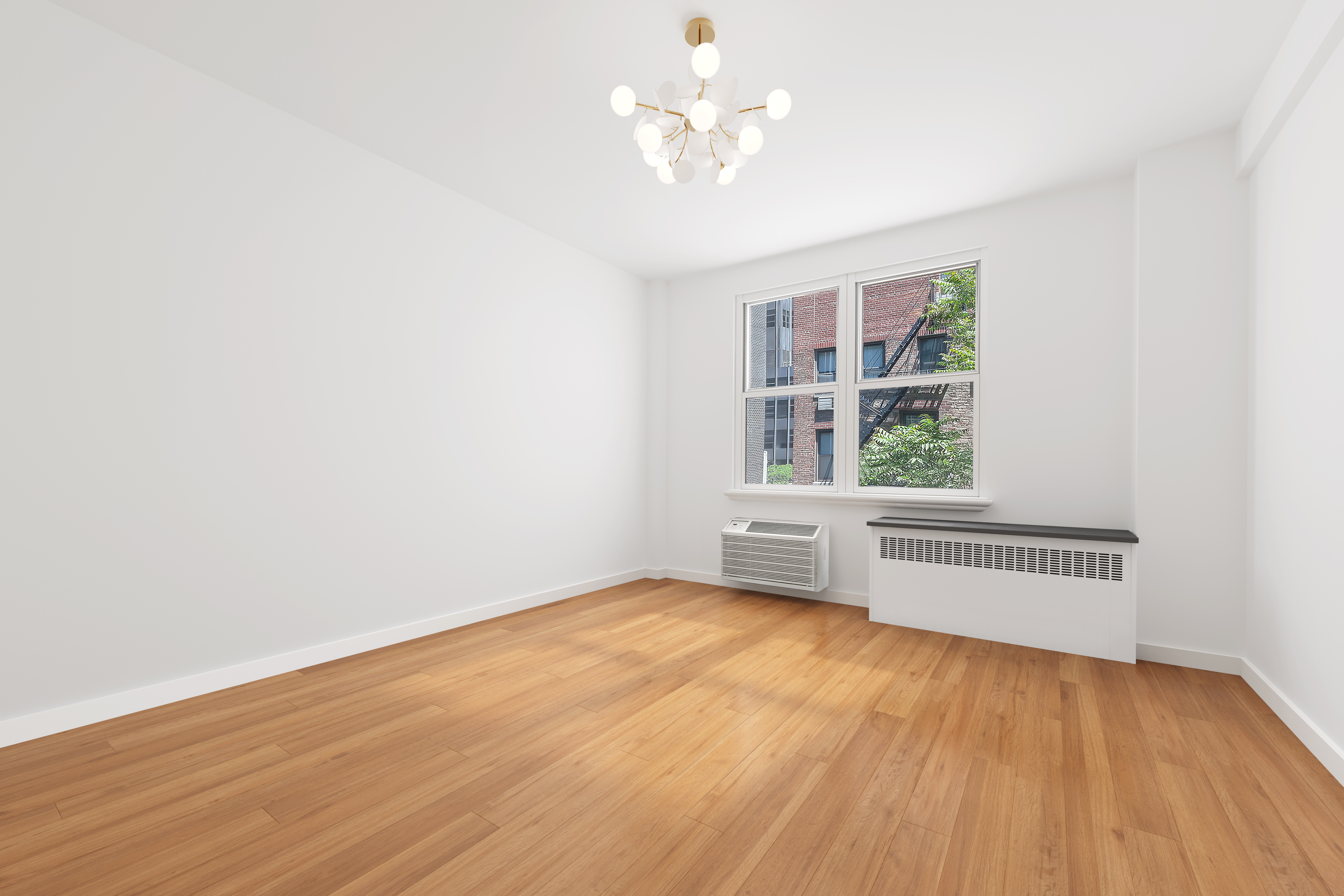 221 East 50th Street, Unit 6D/7D Manhattan, NY 10022 - Photo 17 of 19 an empty room with wooden floor and windows