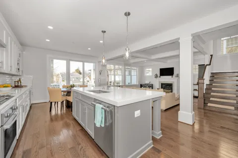 a view of a living room and wooden floor