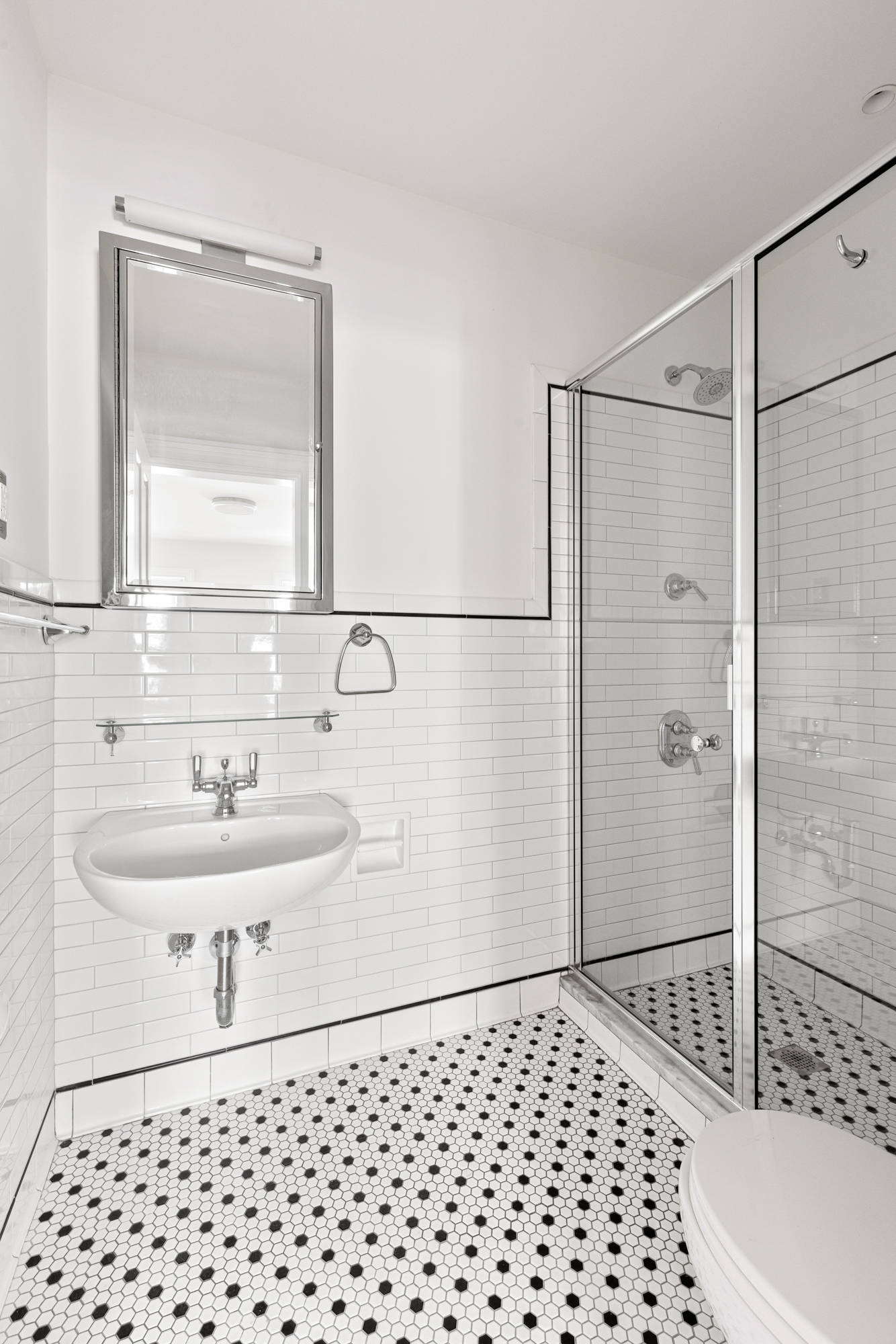 993 Lorimer Street, Unit 2 Brooklyn, NY 11222 - Photo 10 of 15 a bathroom with a sink a toilet and shower