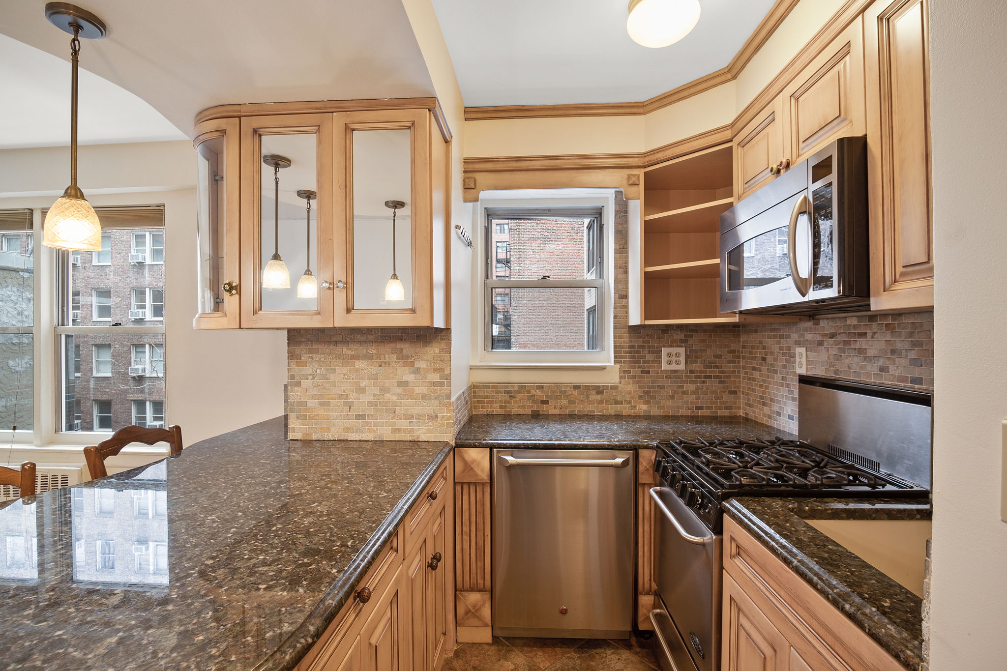 155 East 38th Street, Unit 5L Manhattan, NY 10016 - Photo 4 of 9 a kitchen with stainless steel appliances granite countertop a stove and a sink