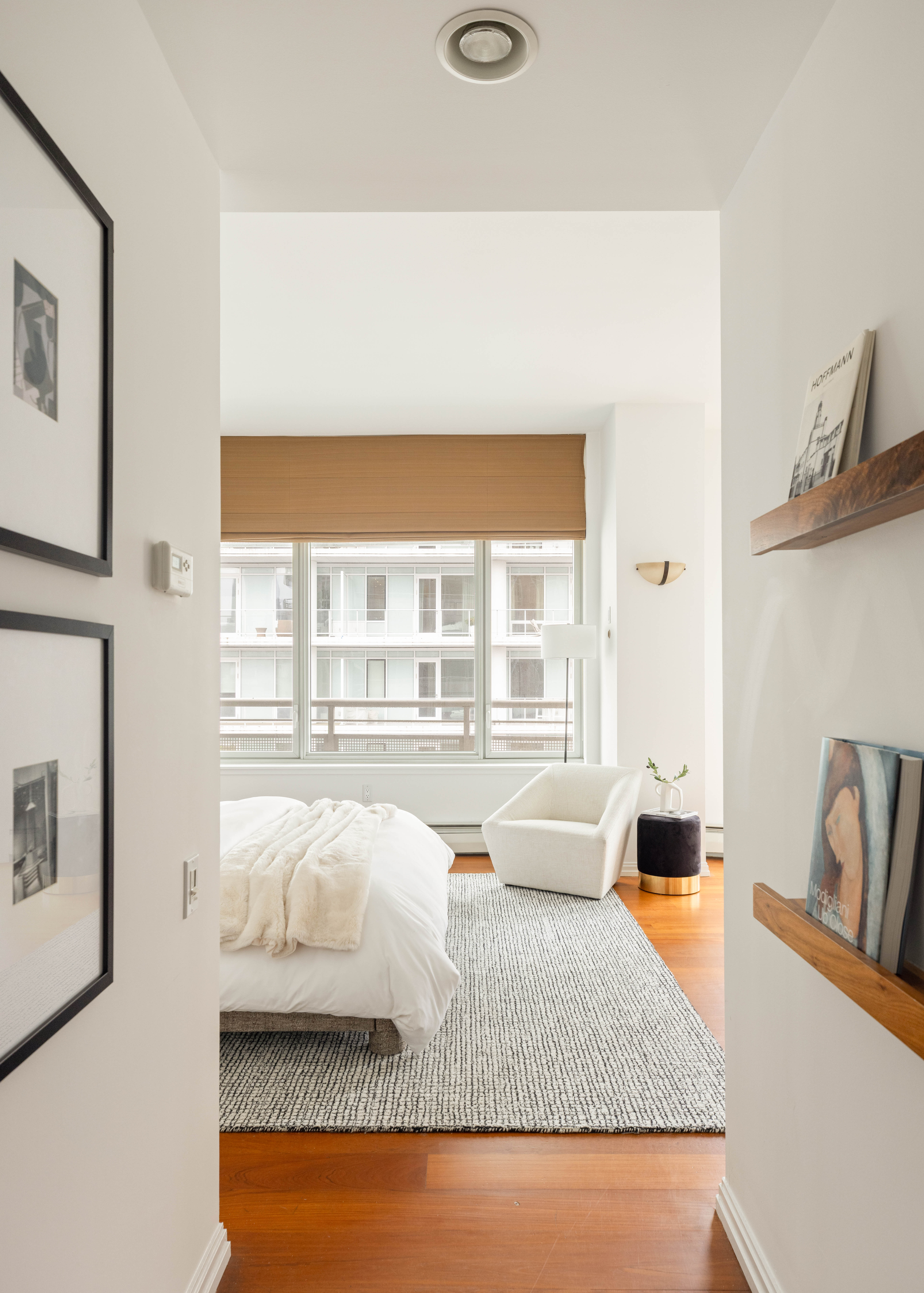 205 East 59th Street, Unit 14B Manhattan, NY 10022 - Photo 9 of 19 a living room with furniture and a large window