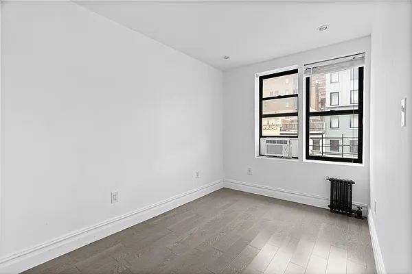 20 Avenue A, Unit 3AB Manhattan, NY 10009 - Photo 7 of 13 an empty room with windows