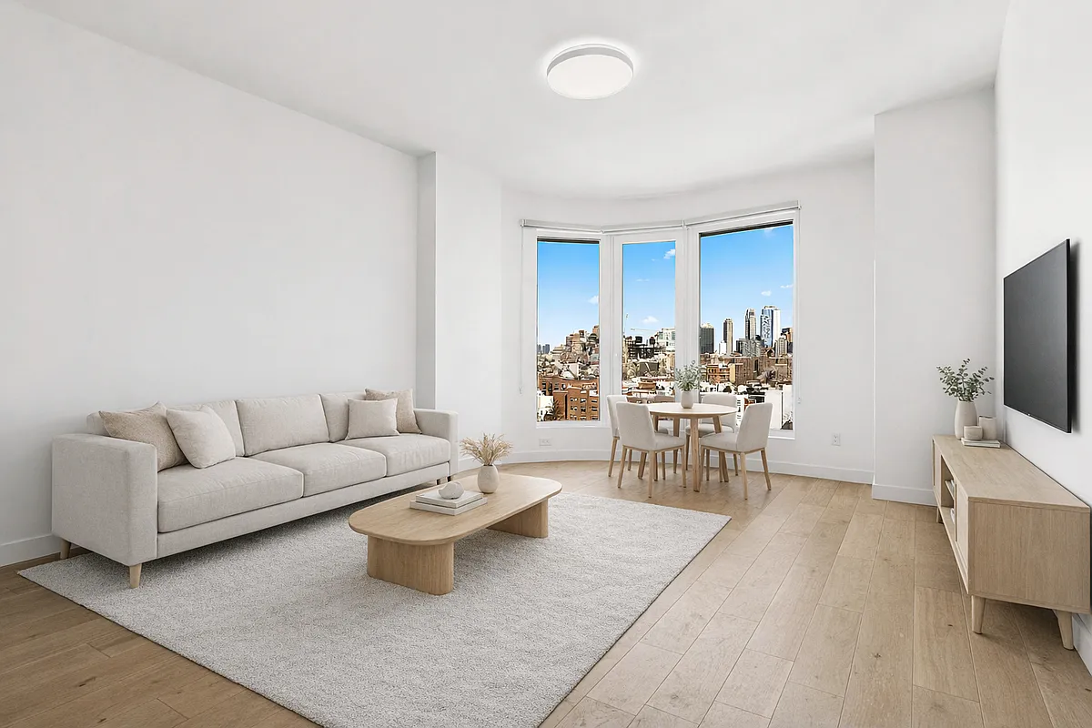 130 2nd Street, Unit 10K Brooklyn, NY 11231 - Photo 2 of 20 a living room with furniture and a flat screen tv