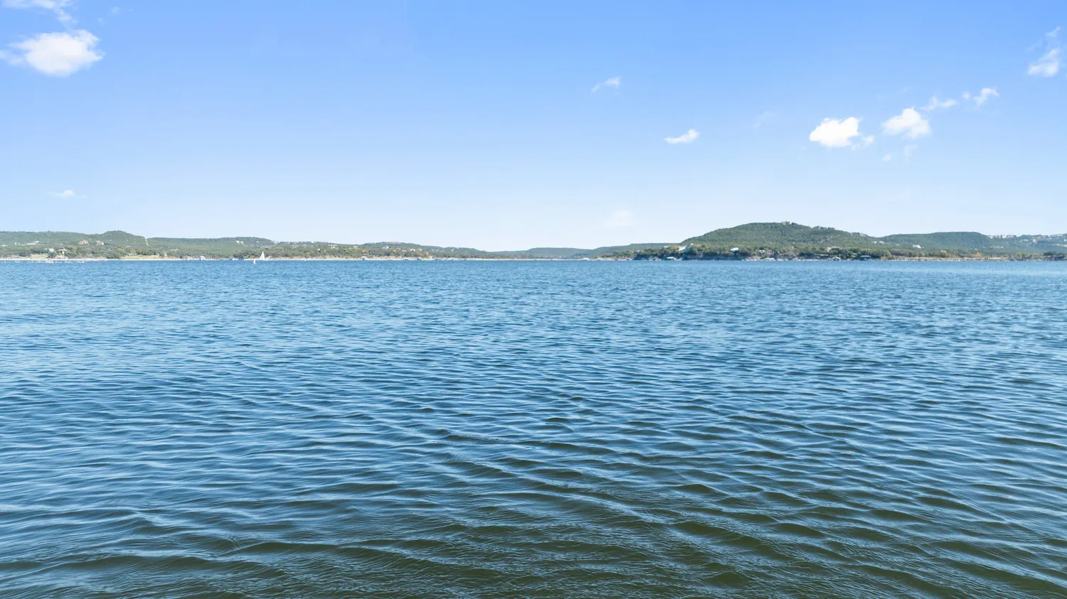 a kitchen with stainless steel appliances granite countertop a sink and a stove