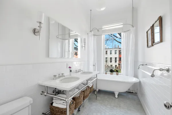 a spacious bathroom with a sink bathtub and a toilet