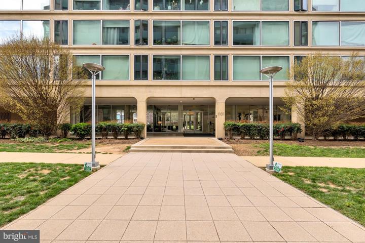 1101 3rd Street Southwest, Unit 206 Washington, DC 20024 - Photo 2 of 21 a view of a building with a yard