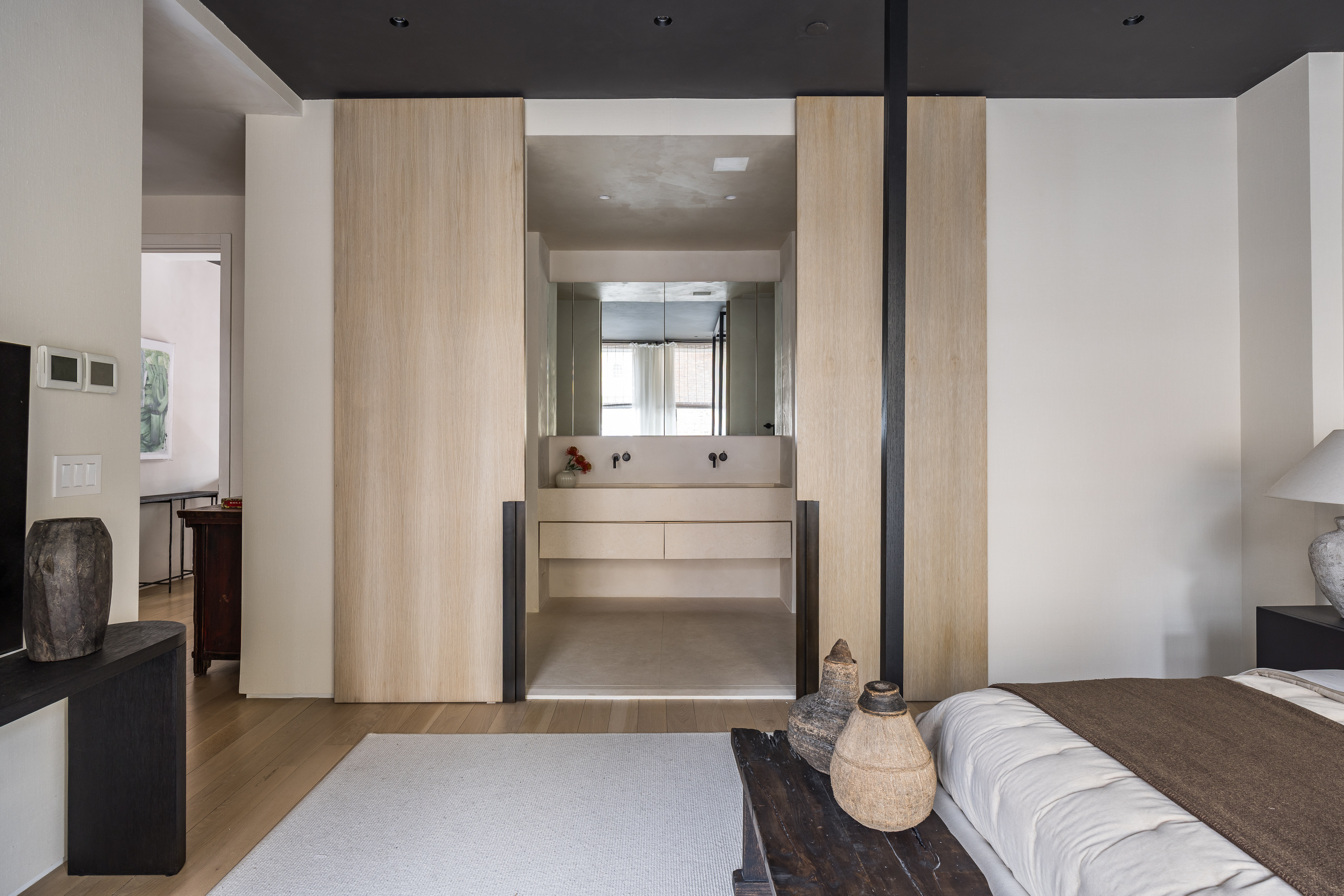 415 Washington Street, Unit 5A Manhattan, NY 10013 - Photo 12 of 21 a bedroom with a bed and a mirror