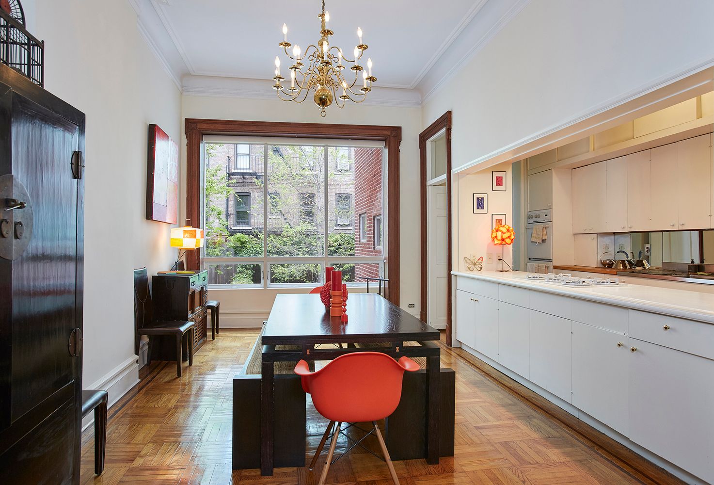 143 West 78th Street Manhattan, NY 10024 - Photo 5 of 17 a room with furniture and a chandelier