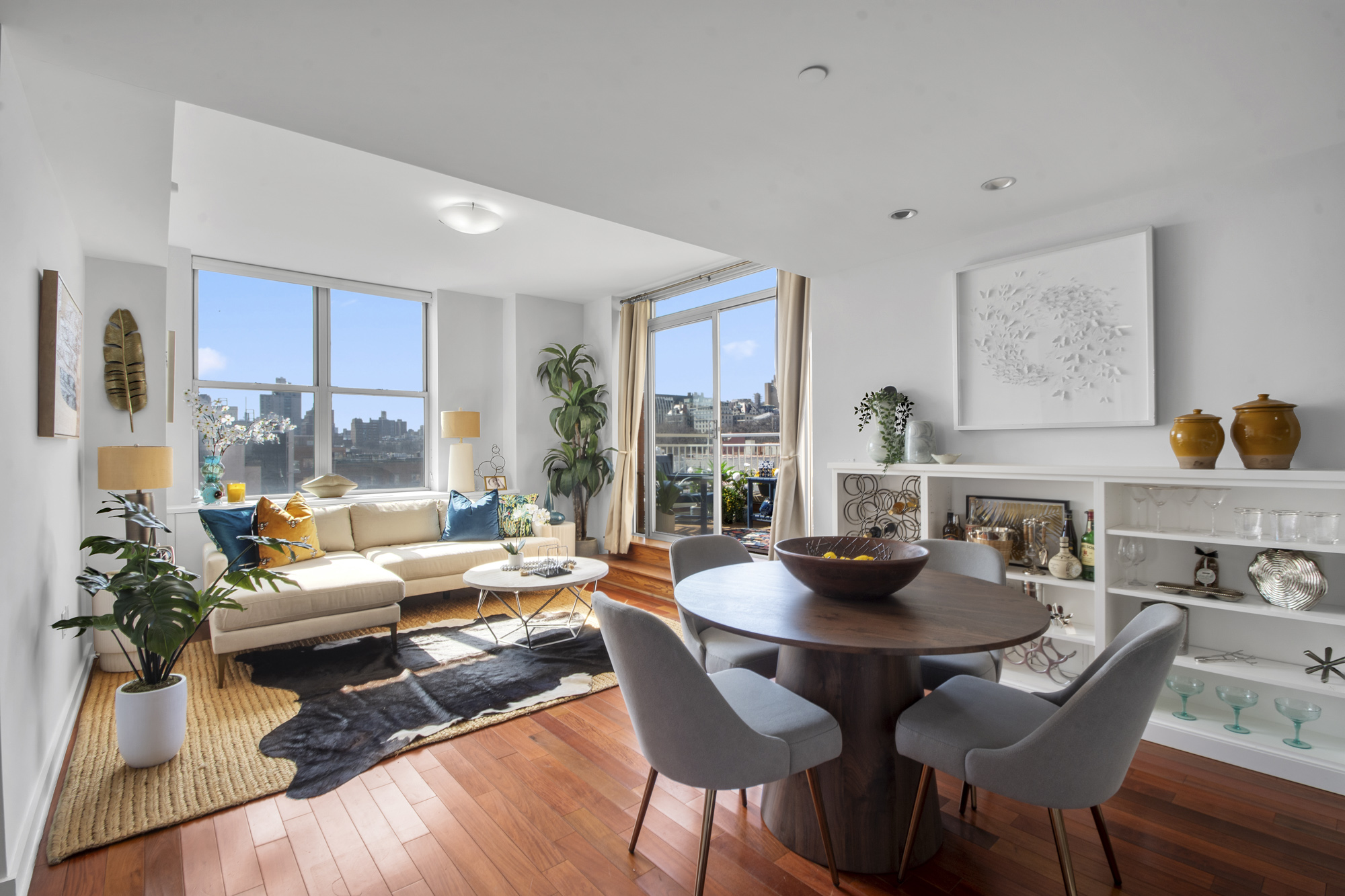 301 West 118th Street, Unit PH1F Manhattan, NY 10026 - Photo 5 of 15 a living room with furniture and a wooden floor