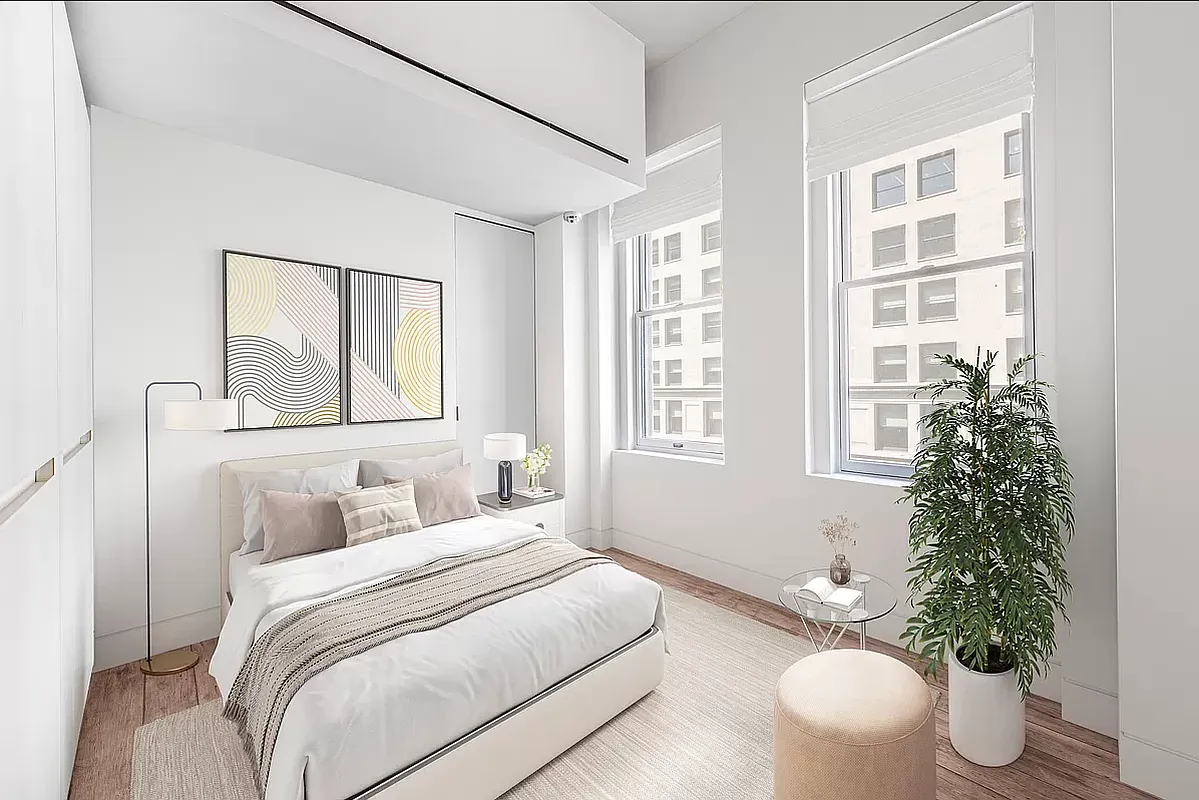 186 5th Avenue, Unit 4A Manhattan, NY 10010 - Photo 6 of 12 a bedroom with a large bed and a potted plant