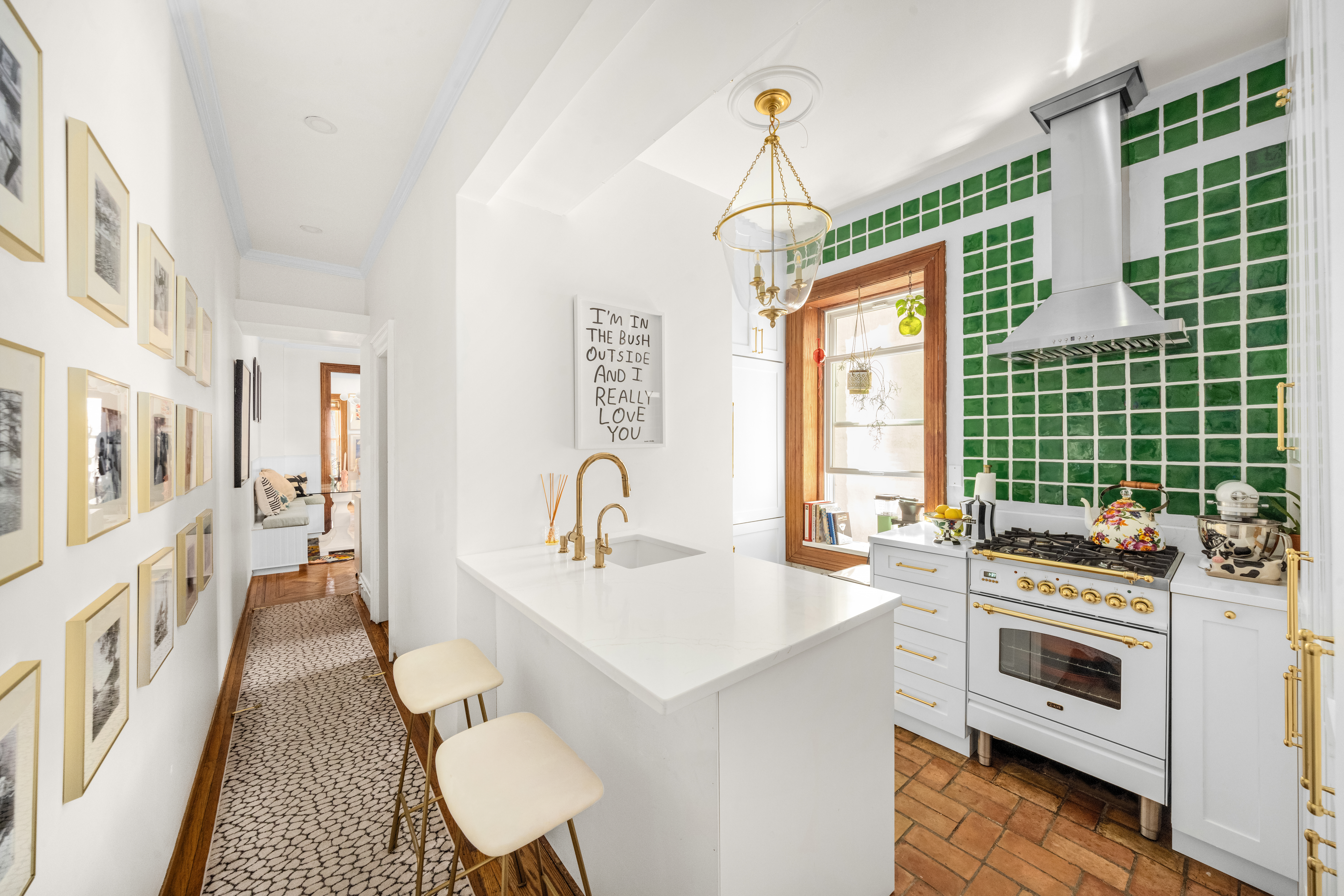 237 West 11th Street, Unit 2B Manhattan, NY 10014 - Photo 7 of 13 a kitchen that has a lot of cabinets and wooden floor