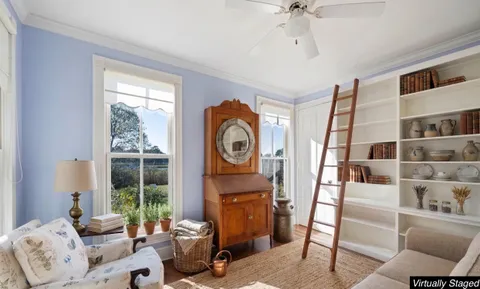 a spacious bedroom with a large bed and a large window