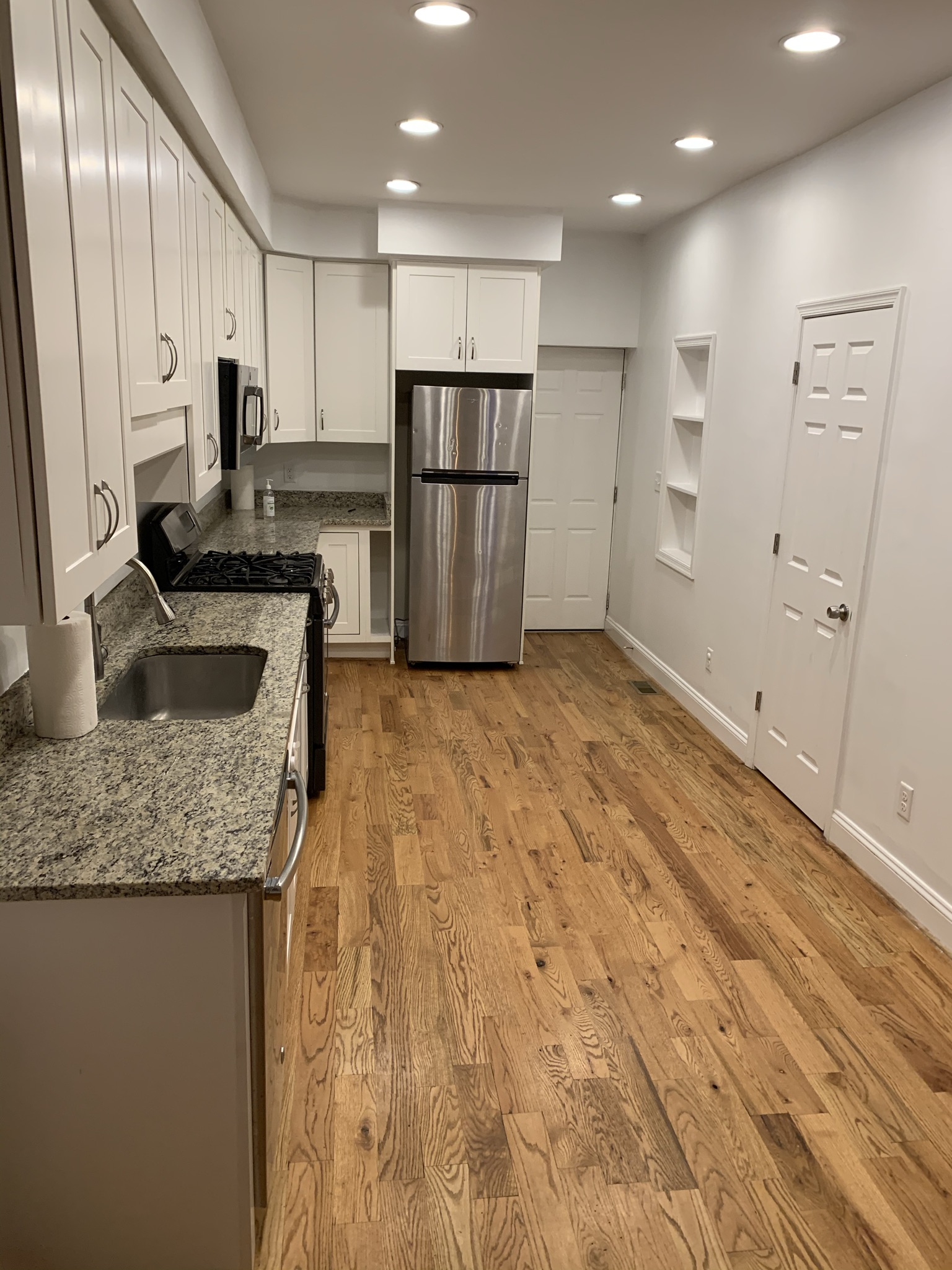 101 West Clement Street Baltimore, MD 21230 - Photo 2 of 7 a kitchen with stainless steel appliances granite countertop a refrigerator and a sink