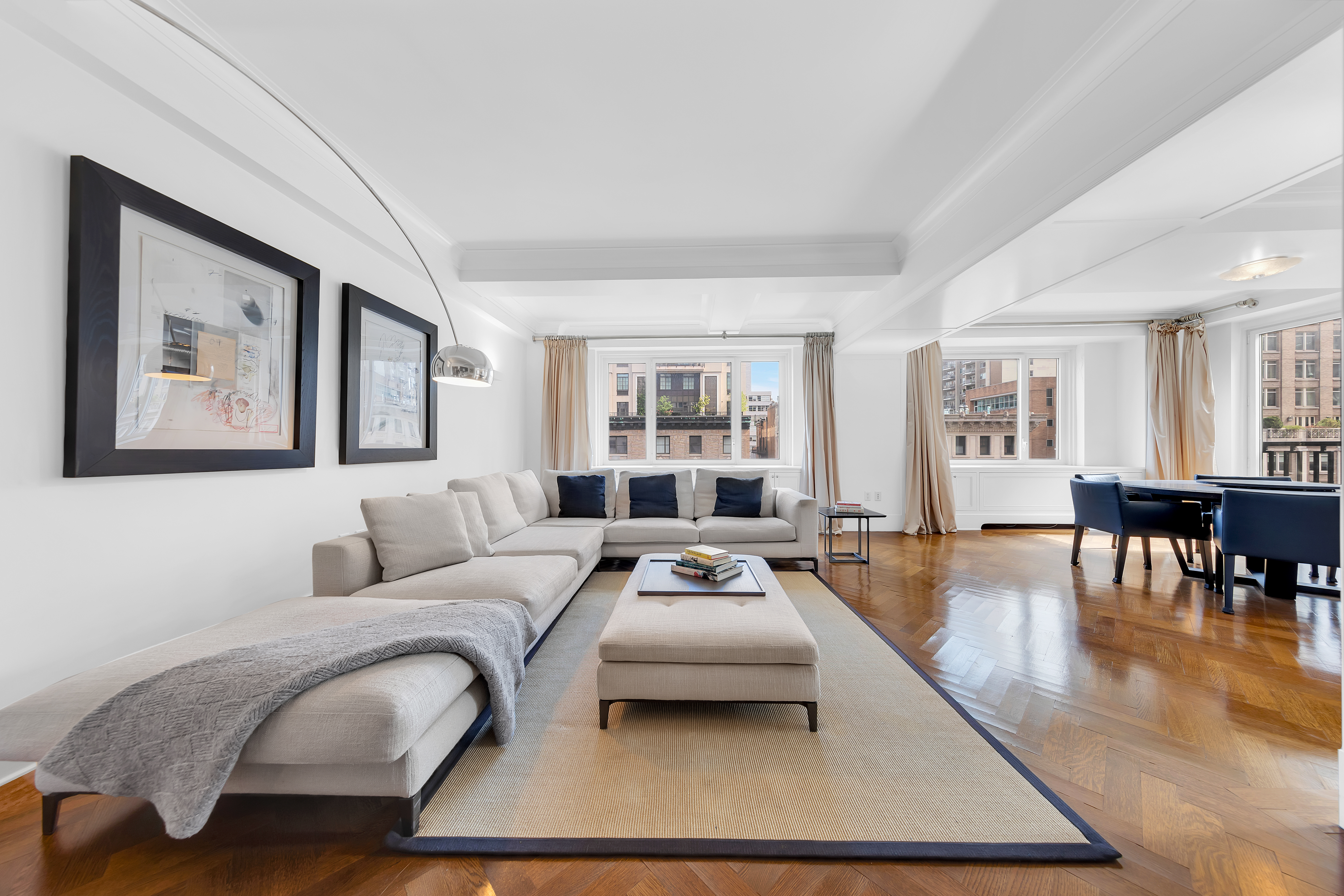 530 Park Avenue, Unit 17A Manhattan, NY 10065 - Photo 3 of 22 a living room with furniture large window and wooden floor