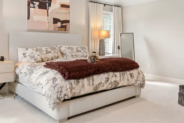 a bathroom with a toilet a sink and a window