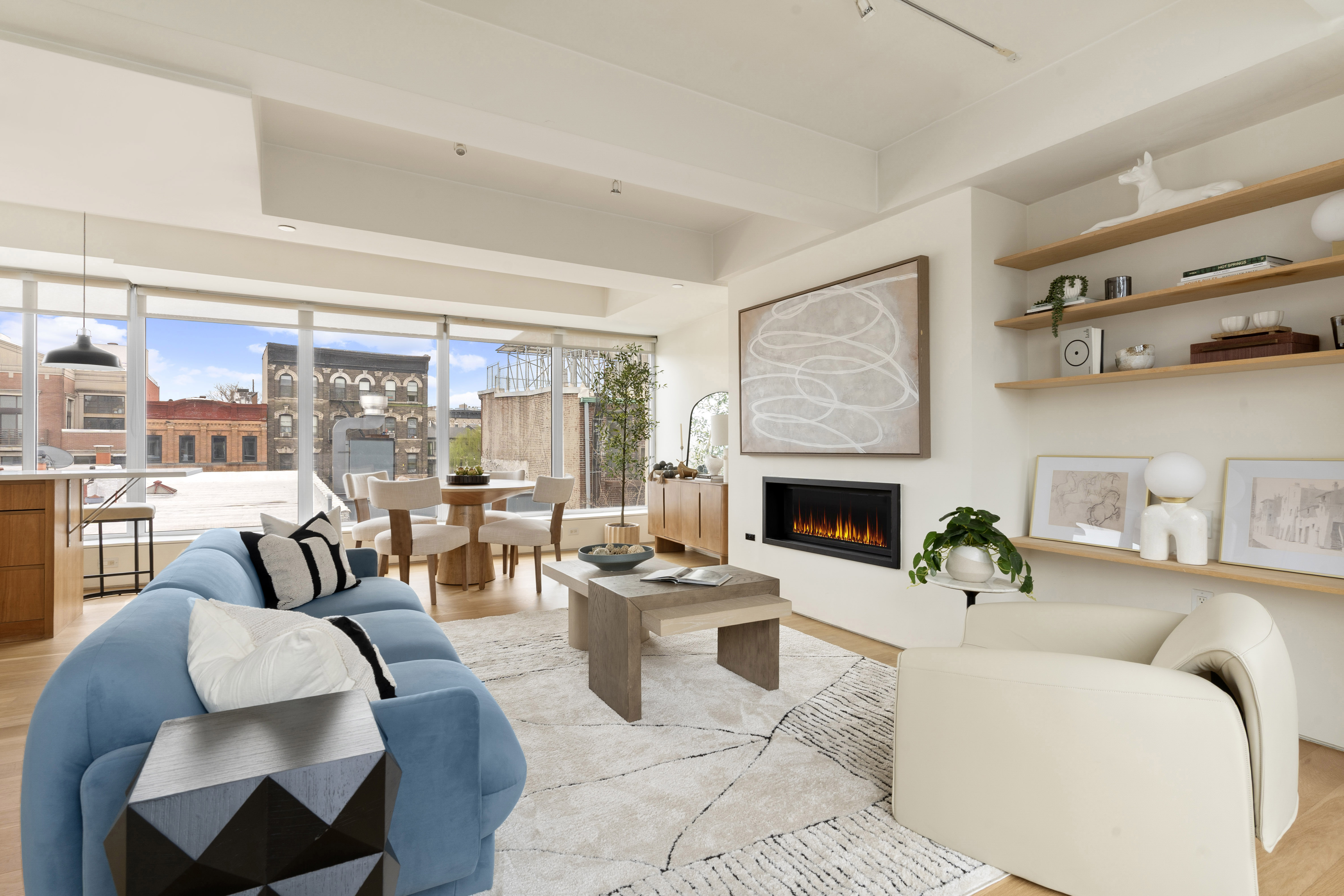 142 North 1st Street, Unit PH Brooklyn, NY 11249 - Photo 2 of 15 a living room with furniture and a fireplace