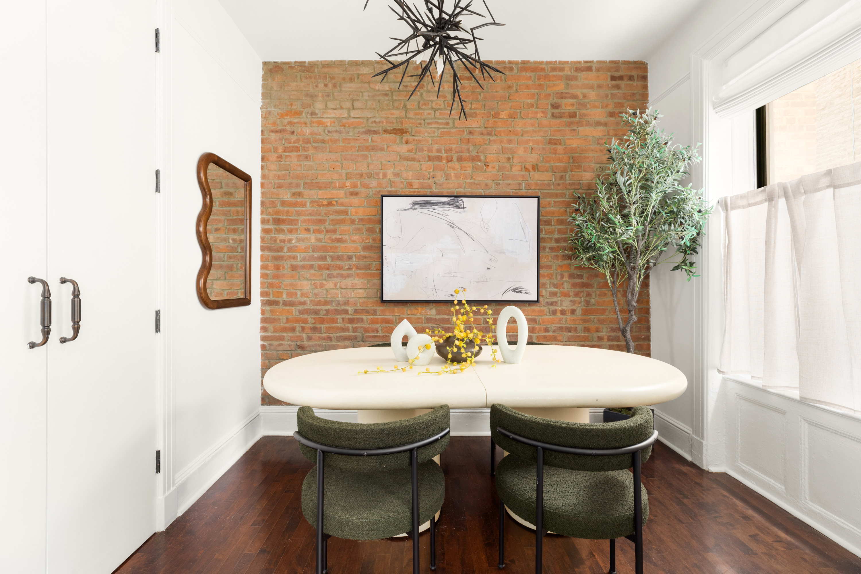 126 East 12th Street, Unit 2C Manhattan, NY 10003 - Photo 2 of 10 a dining room with a table and chairs