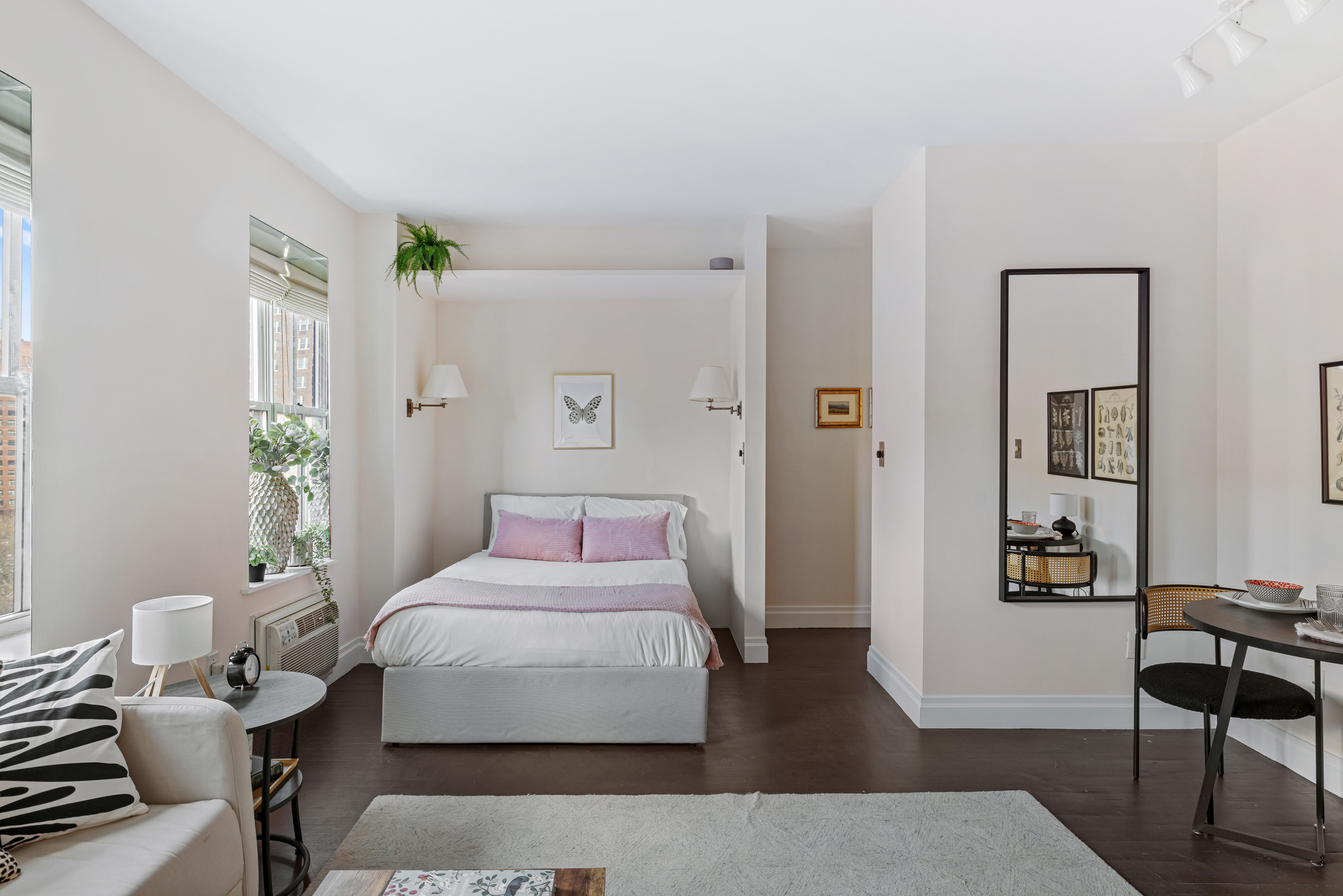 99 Bank Street, Unit 7E Manhattan, NY 10014 - Photo 5 of 8 a bedroom with a bed and wooden floor