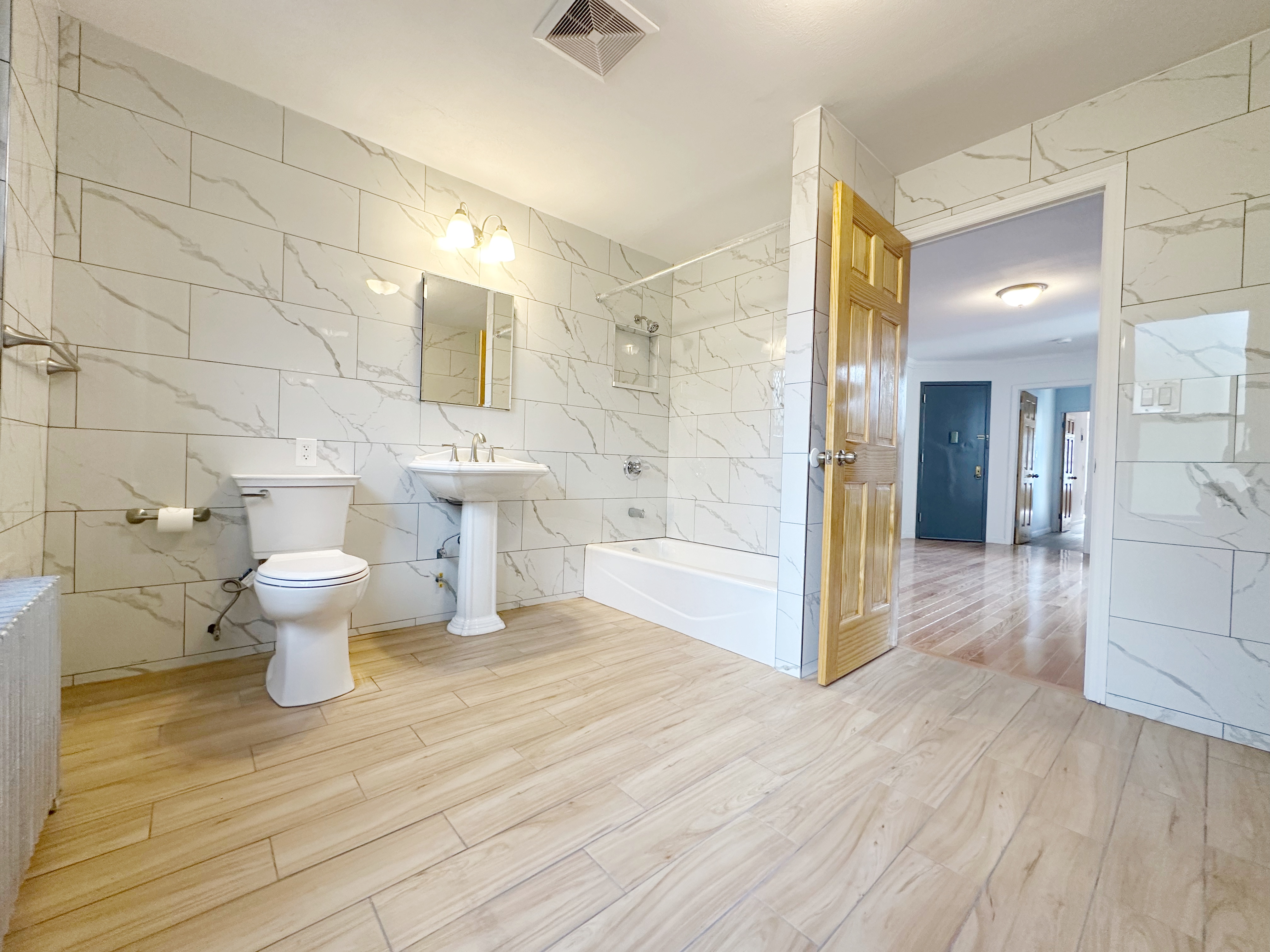 75 Madison Street, Unit 9 Manhattan, NY 10002 - Photo 6 of 6 a bathroom with a sink and a toilet