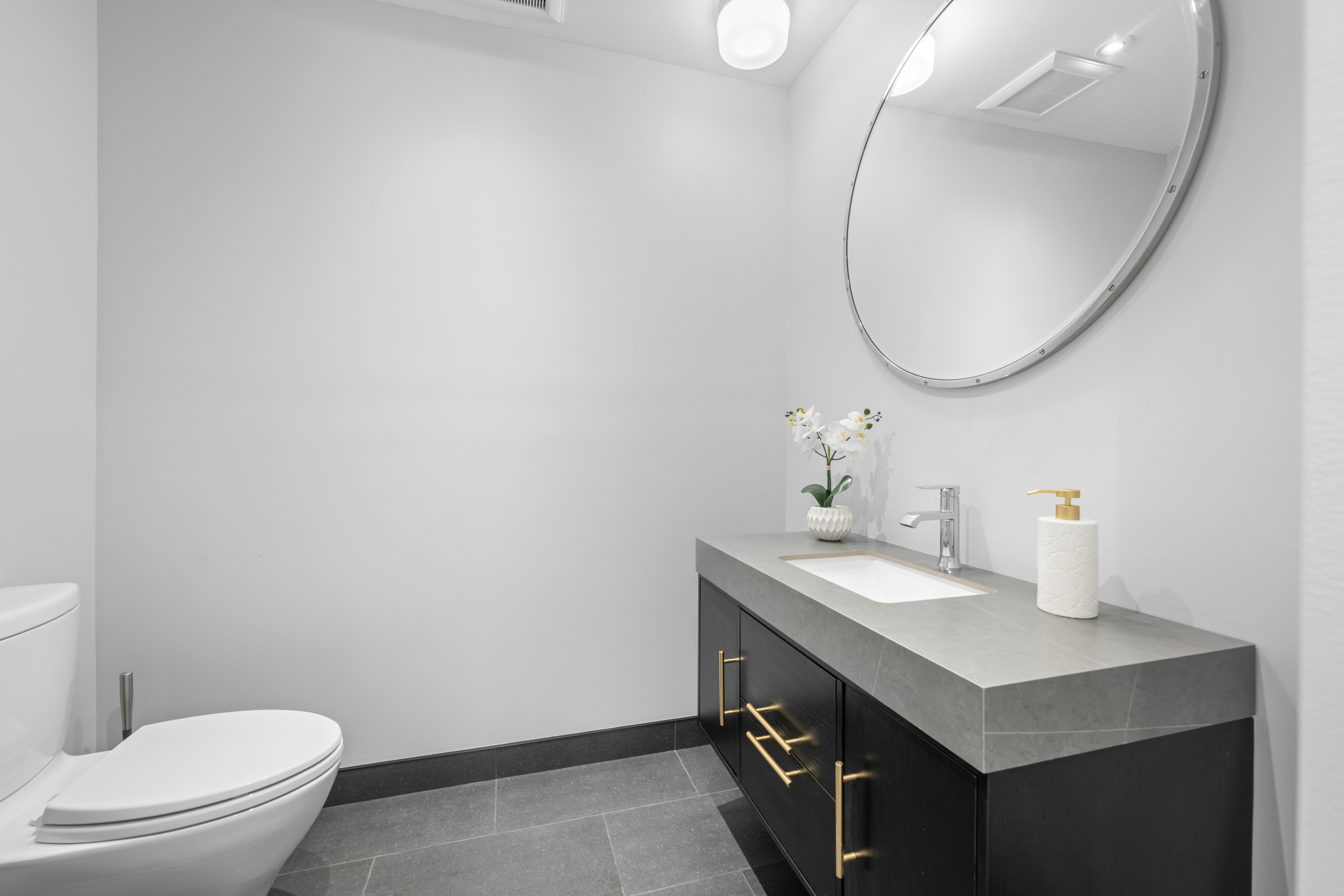 850 Lesley Road Villanova, PA 19085 - Photo 13 of 45 a bathroom with a sink a toilet and a mirror