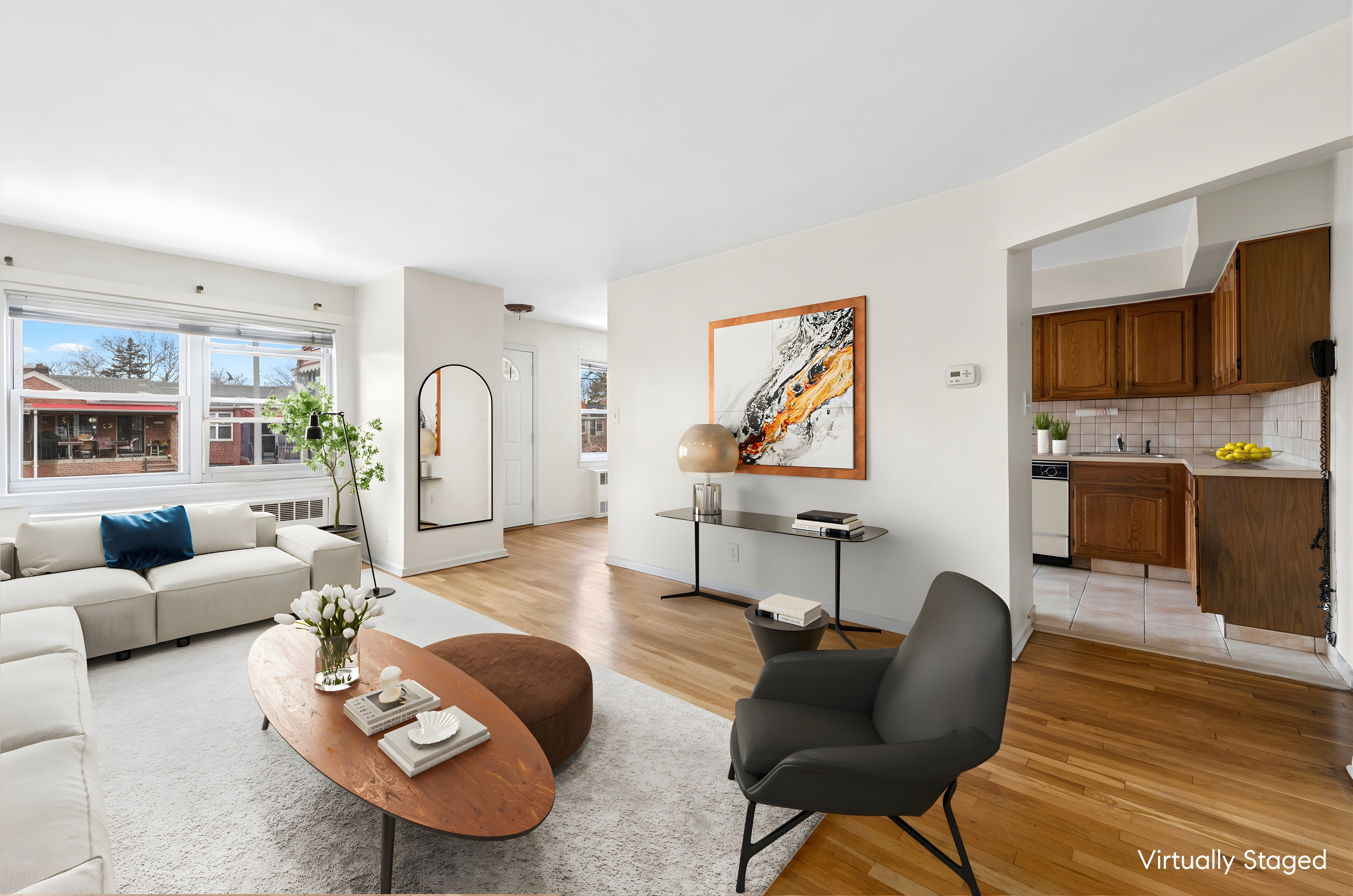 25-36 72nd Street Queens, NY 11370 - Photo 2 of 17 a living room with furniture a flat screen tv and a fireplace