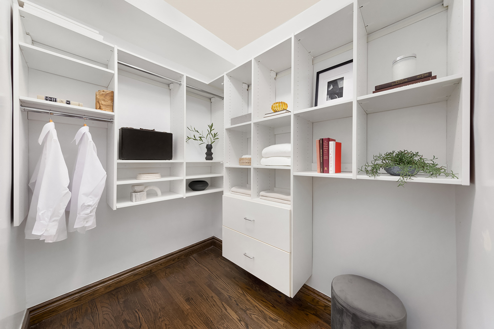 353 West 56th Street, Unit 2G Manhattan, NY 10019 - Photo 5 of 13 a view of walk in closet with clothes and shoes