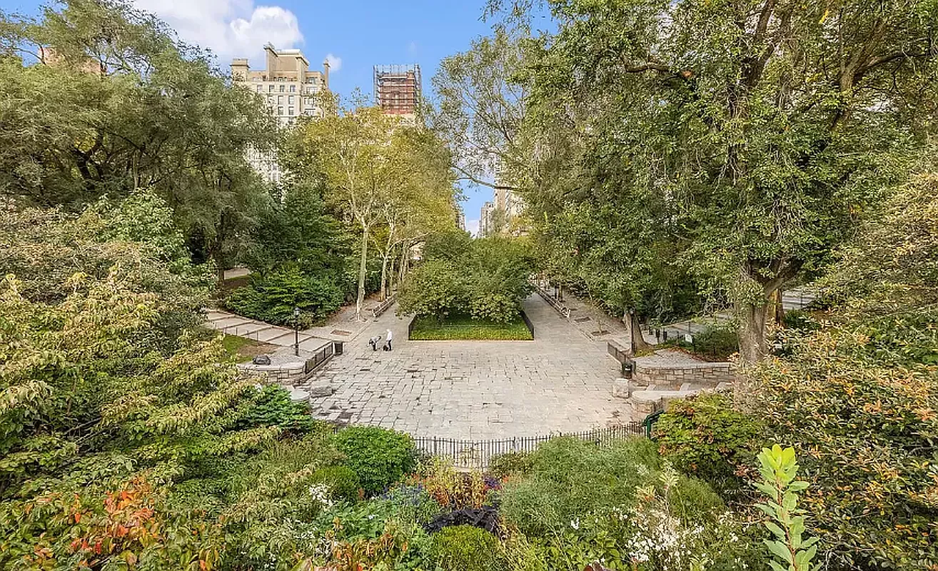 1582 York Avenue, Unit 2C Manhattan, NY 10028 - Photo 10 of 12 a view of a yard with plants and large trees